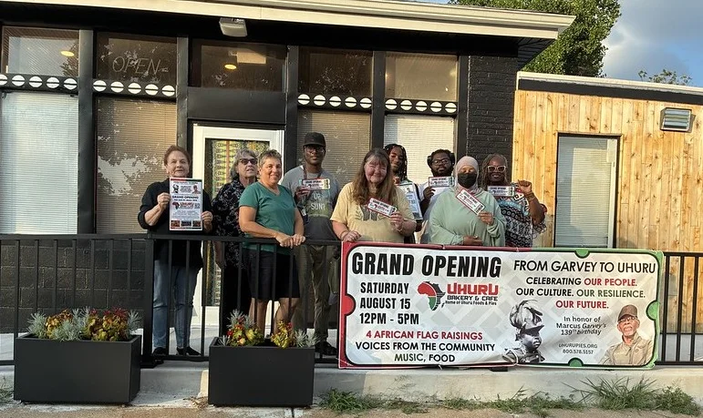 Community members celebrating a restaurant grand opening event
