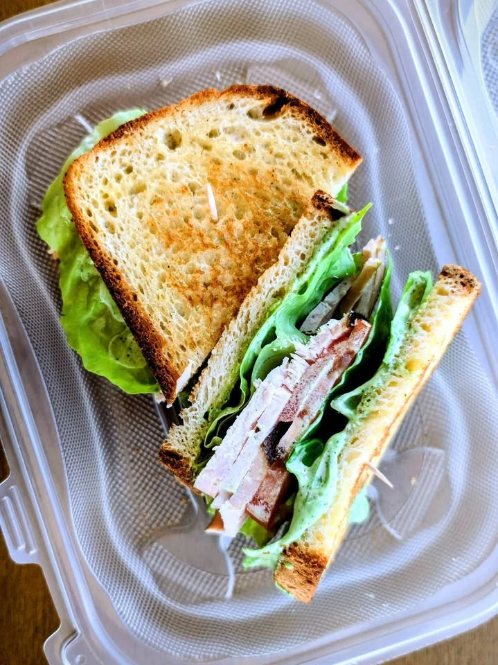 Our smoked turkey breast smothered with turkey mustard gravy sauce. Generously sliced and paired with beefsteak tomatoes, bacon, butter lettuce. Encapsulated with wonderfully toasted gluten-free sliced bread.