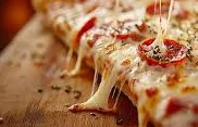 Cheesy pepperoni pizza slice with gooey melted cheese