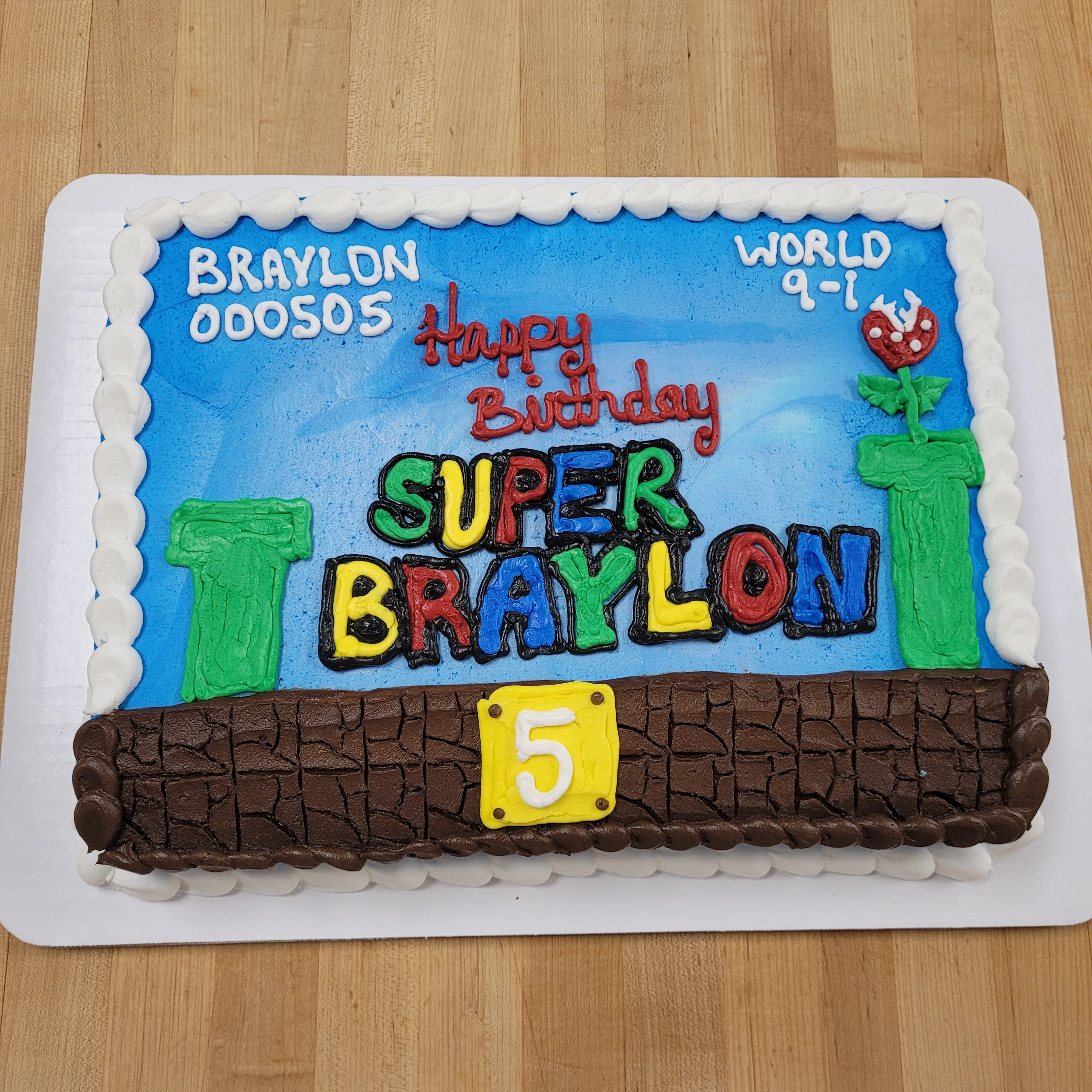Colorful birthday cake themed after a video game