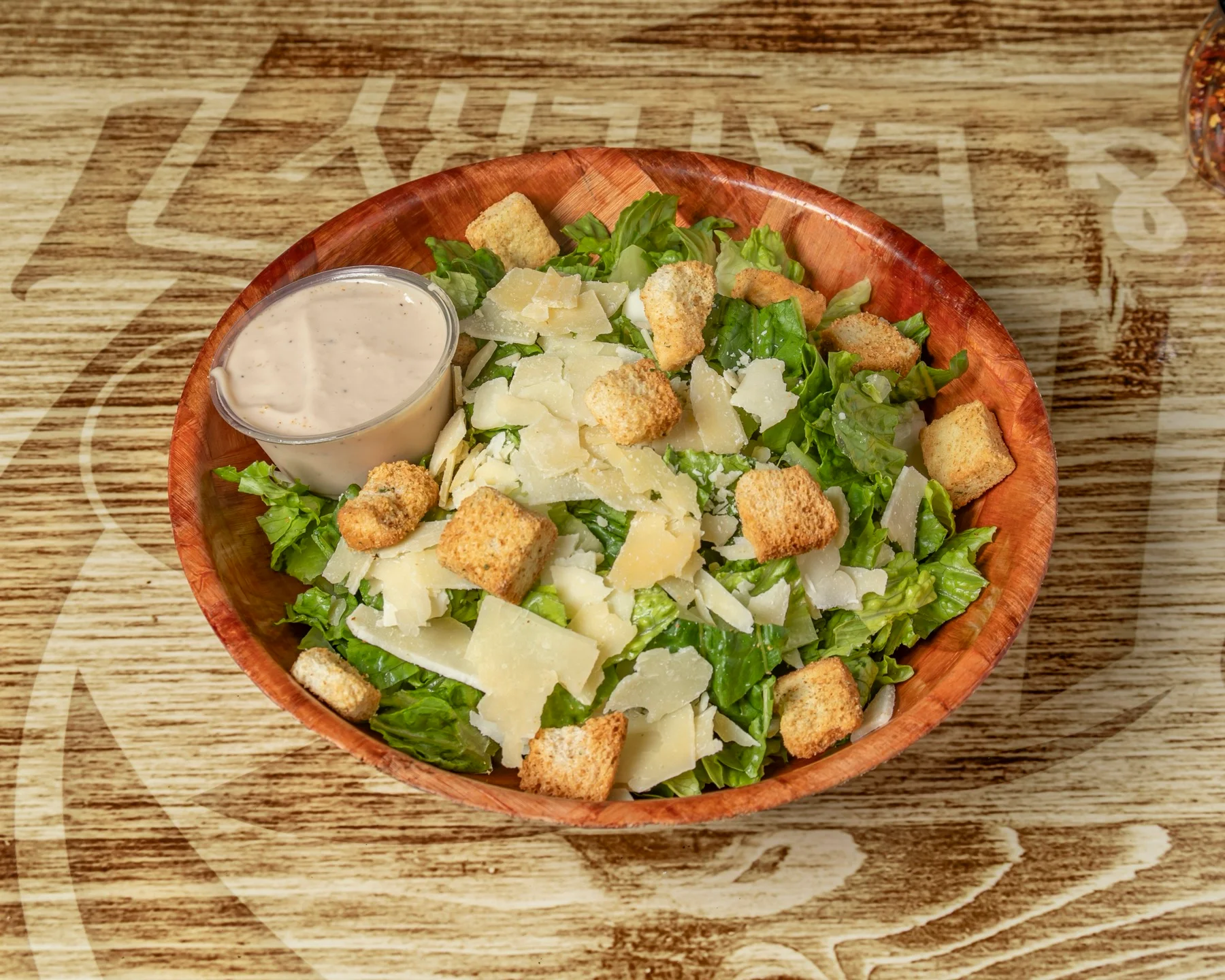 Caesar salad with romaine, croutons and parmesan at Stadium Pepz