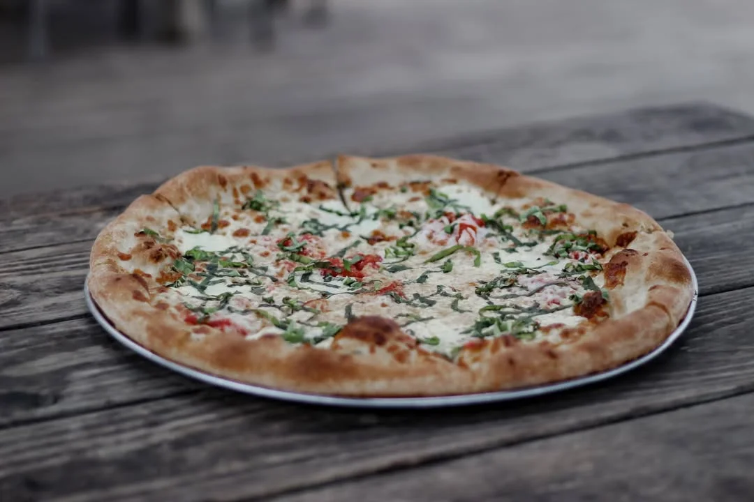 Italian Margherita pizza with basil and mozzarella on a plate