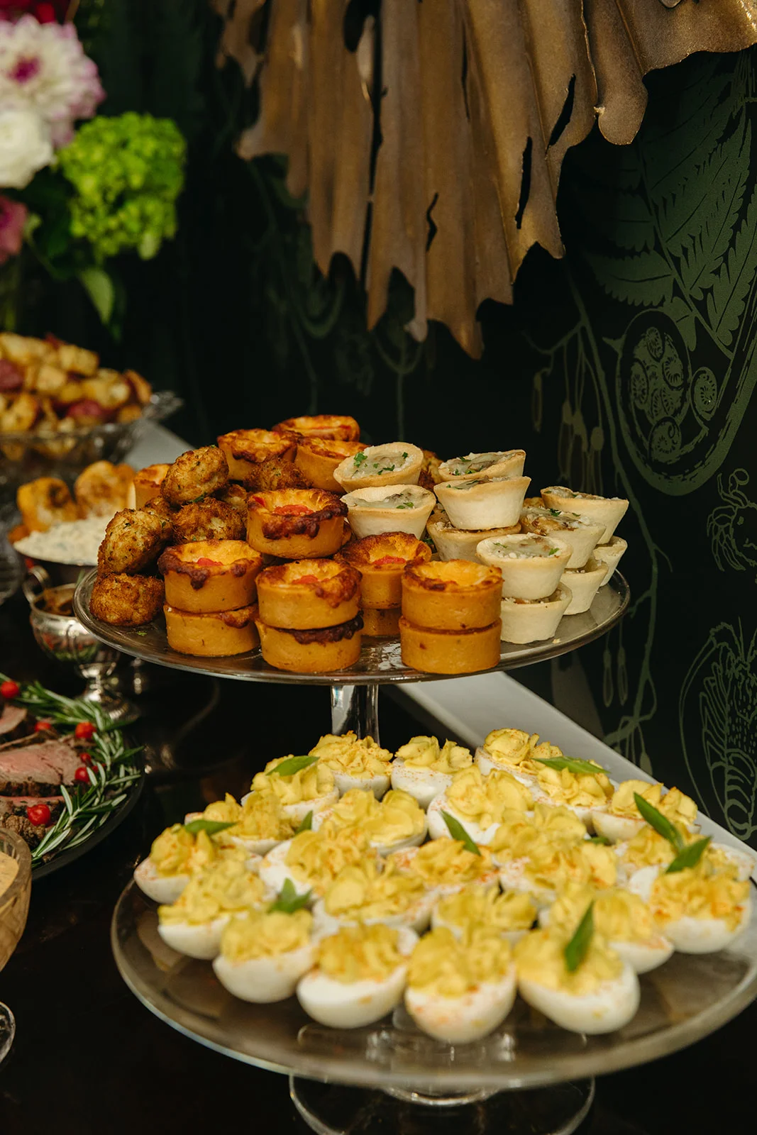 A beautifully arranged table with delicious food and drinks at a restaurant.