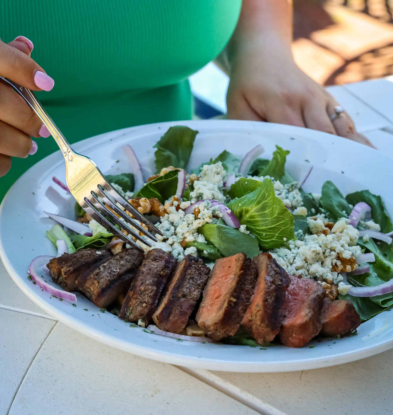Grilled steak salad with greens and blue cheese