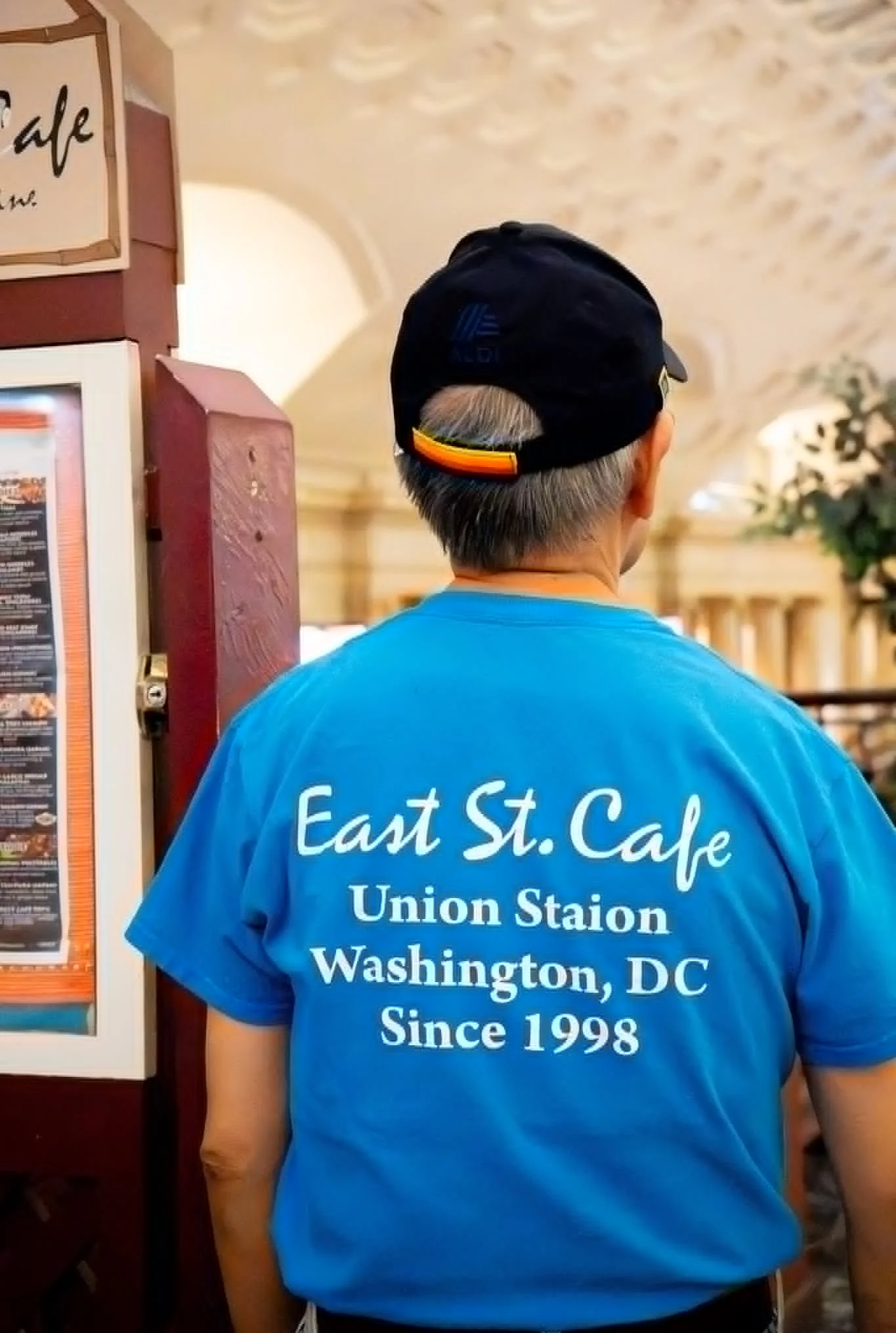 Employee wearing East St. Cafe shirt at Union Station, Washington, DC