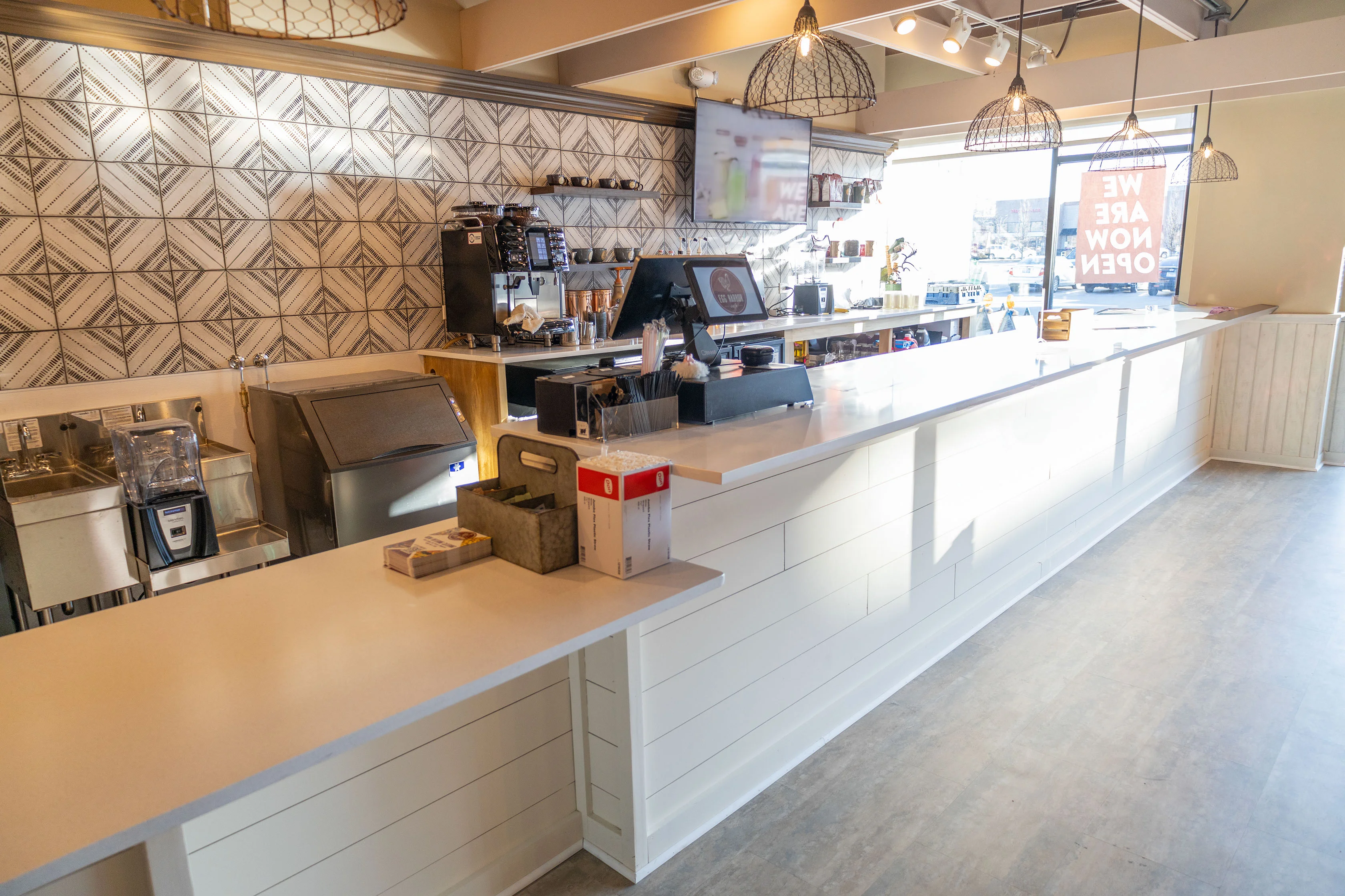 Modern café counter with stylish decor and coffee equipment