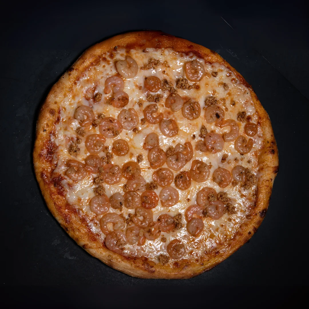 Shrimp pizza with melted cheese and savory toppings