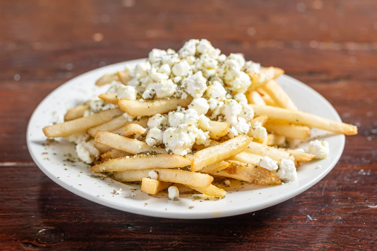 Greek-style fries topped with feta cheese