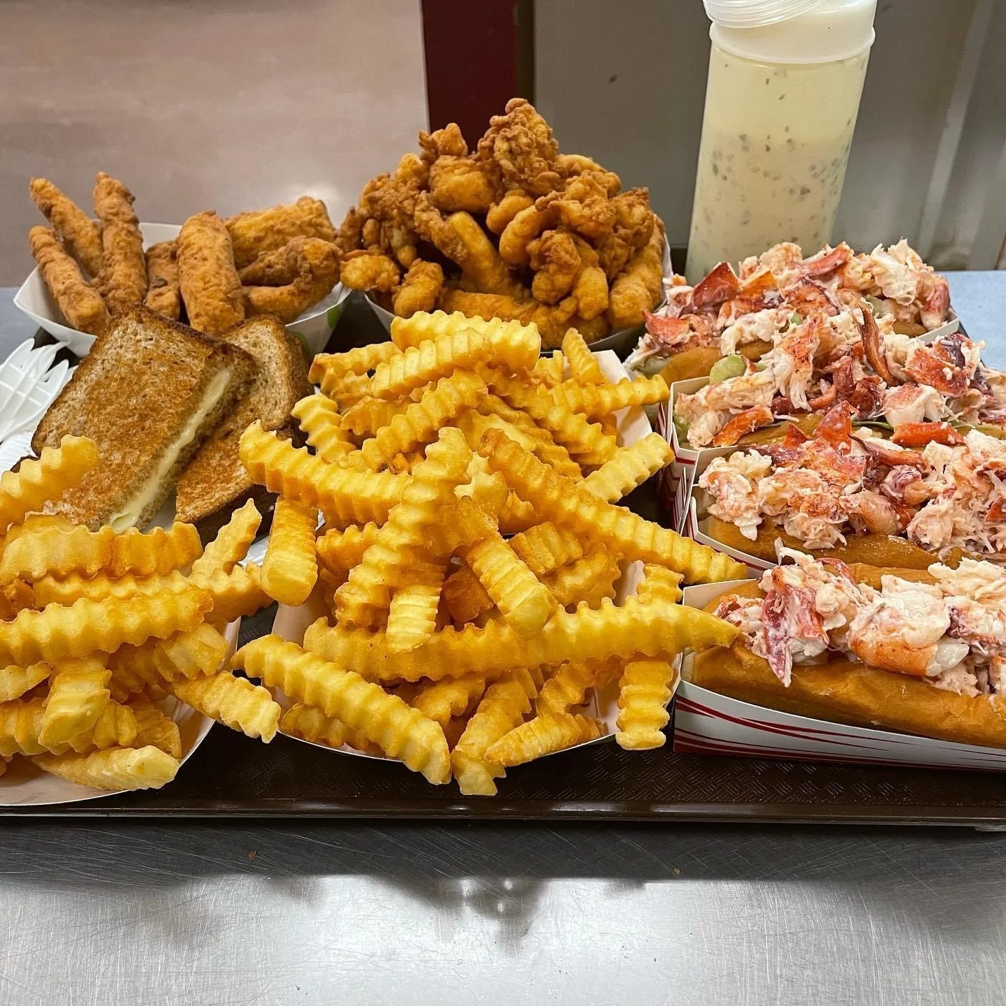 Lobster rolls with crinkle fries and fried chicken platter
