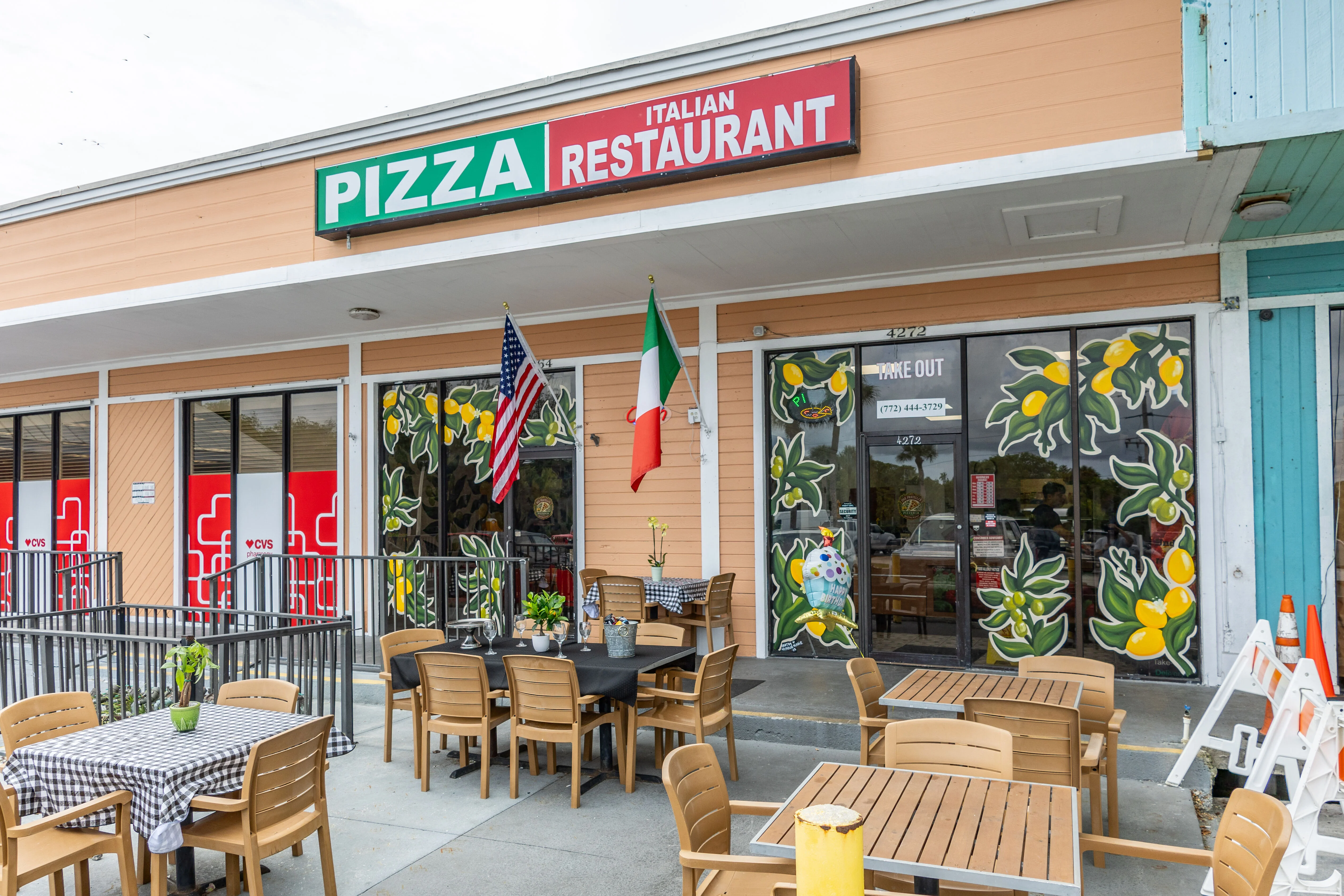 Charming Italian restaurant exterior with outdoor seating