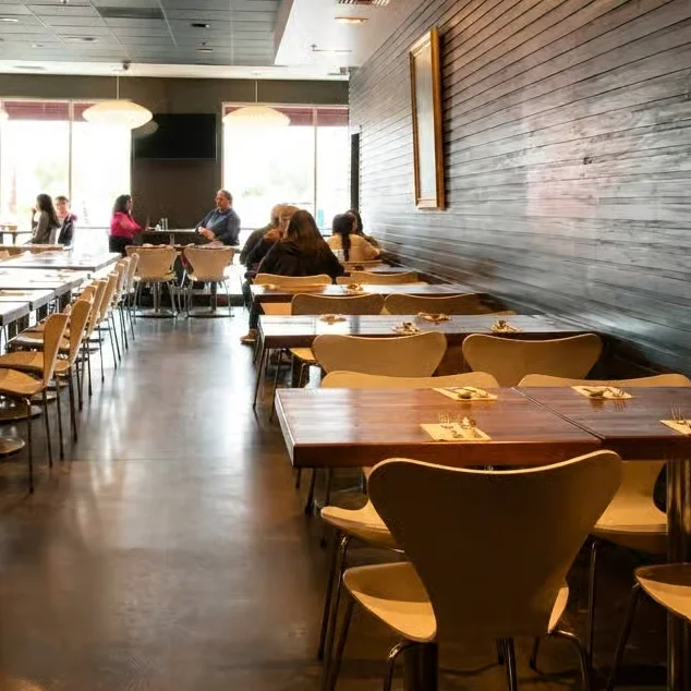 Modern restaurant interior with wooden accents and cozy seating