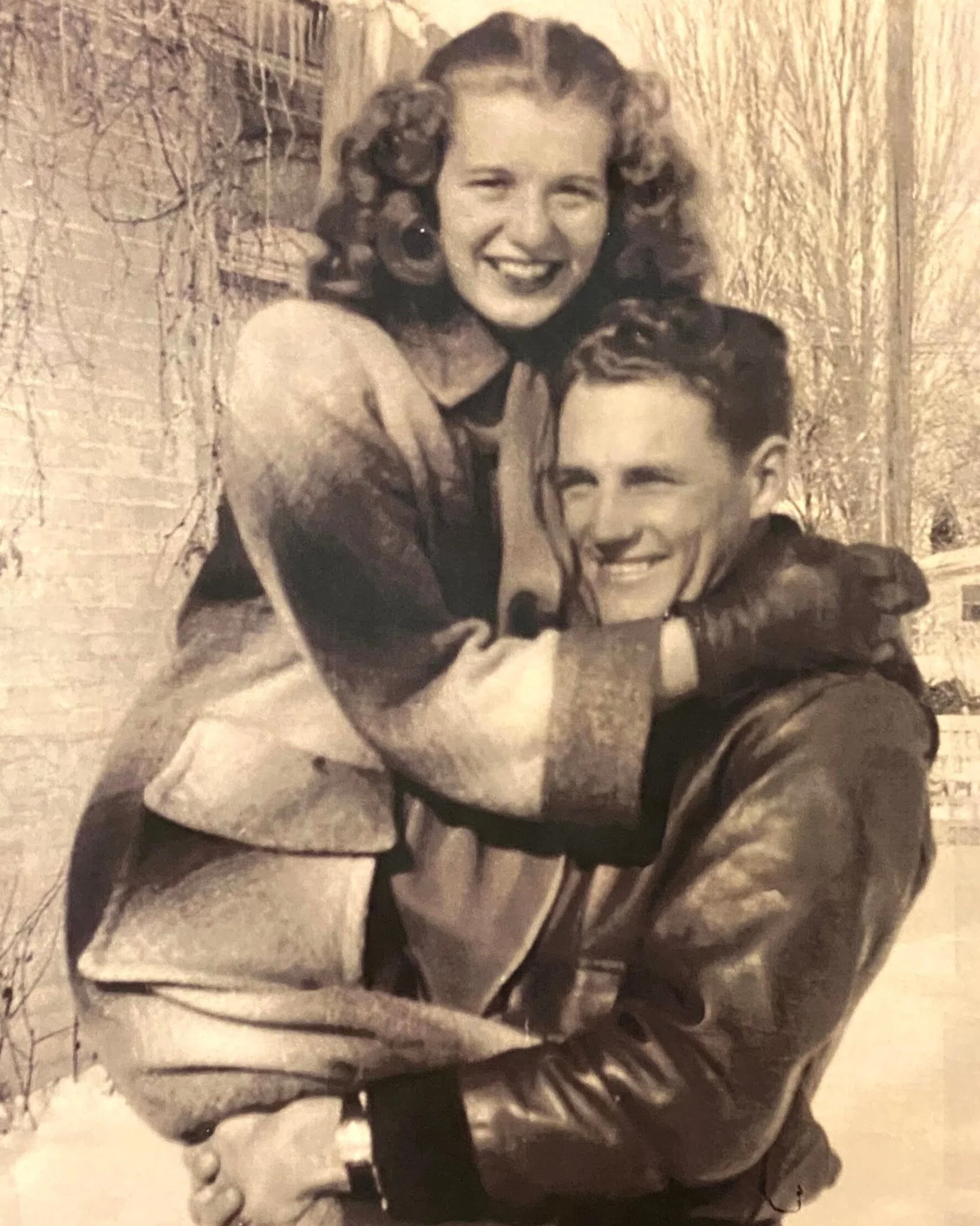 Vintage couple sharing a joyful moment outdoors