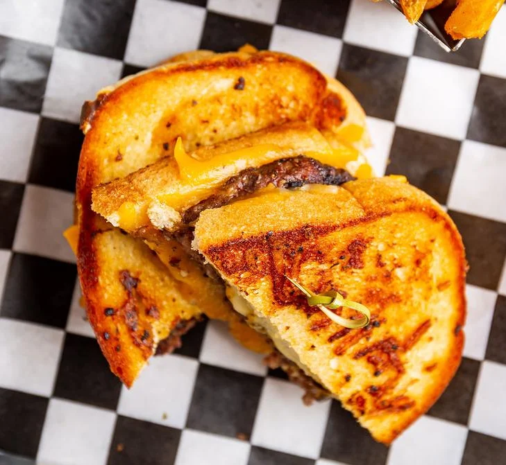 Grilled cheese burger sandwich with crispy fries