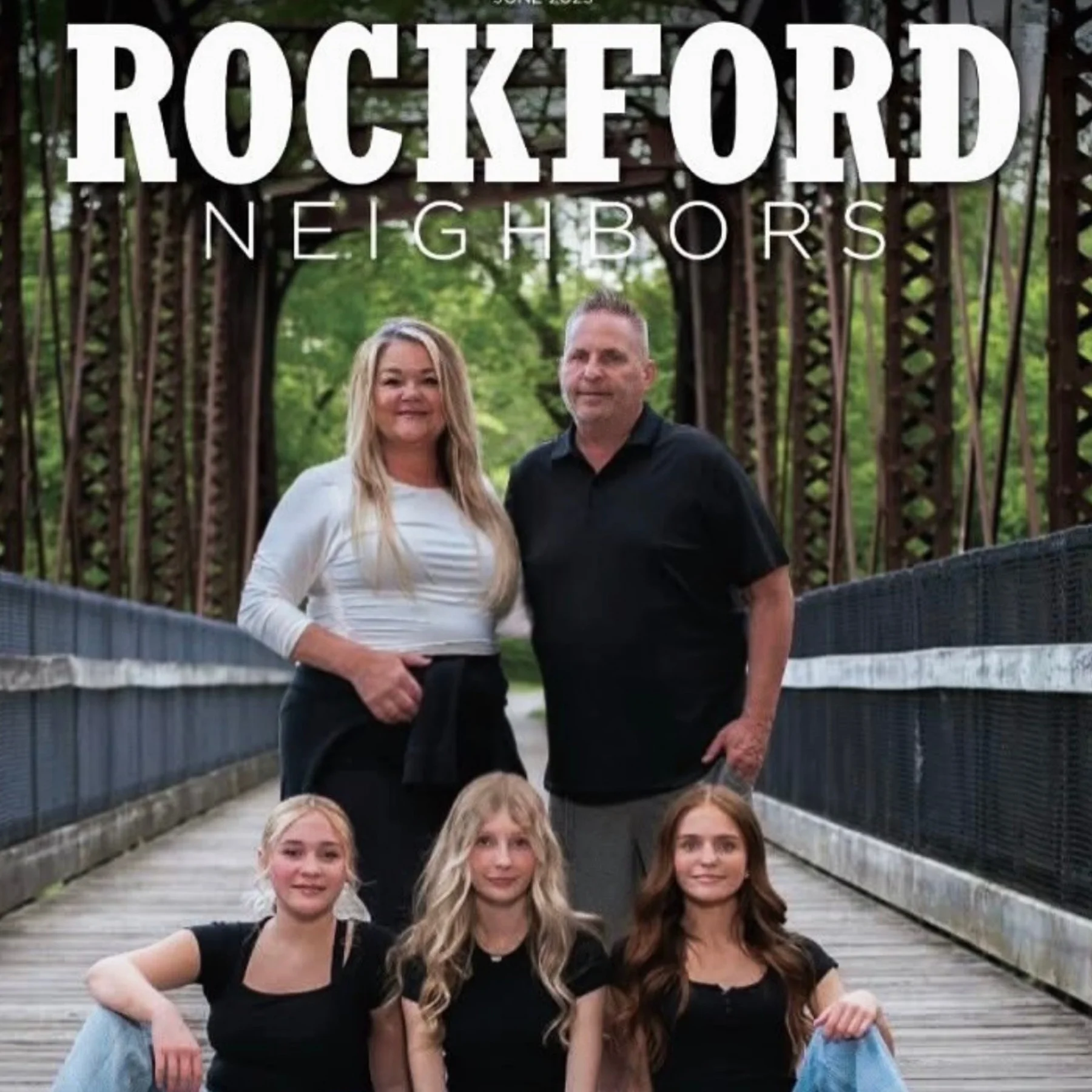 Family portrait on a bridge in Rockford neighborhood