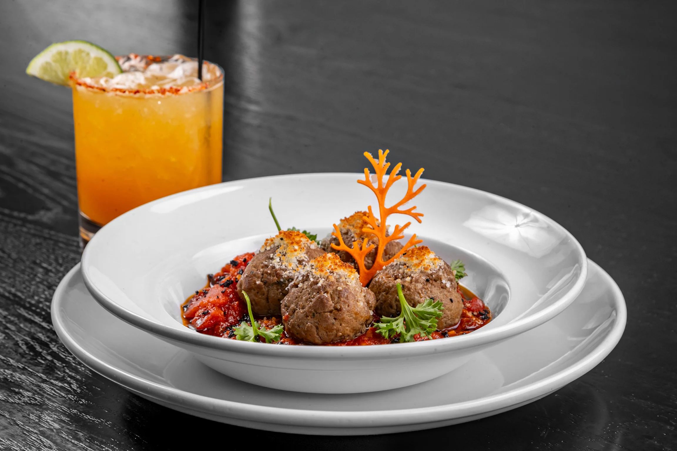 Savory Italian meatballs in marinara sauce with garnish