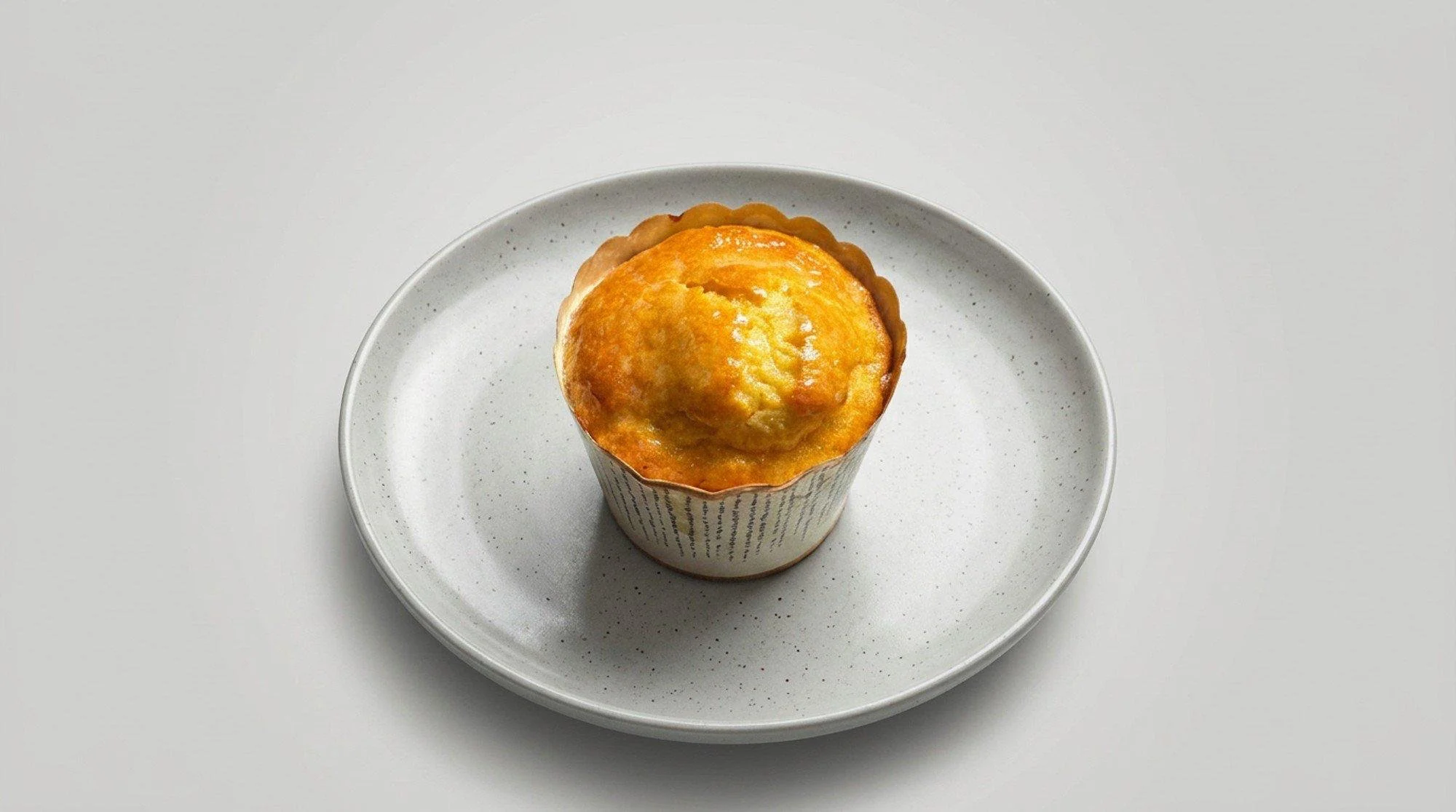 Freshly baked corn muffin on a plate