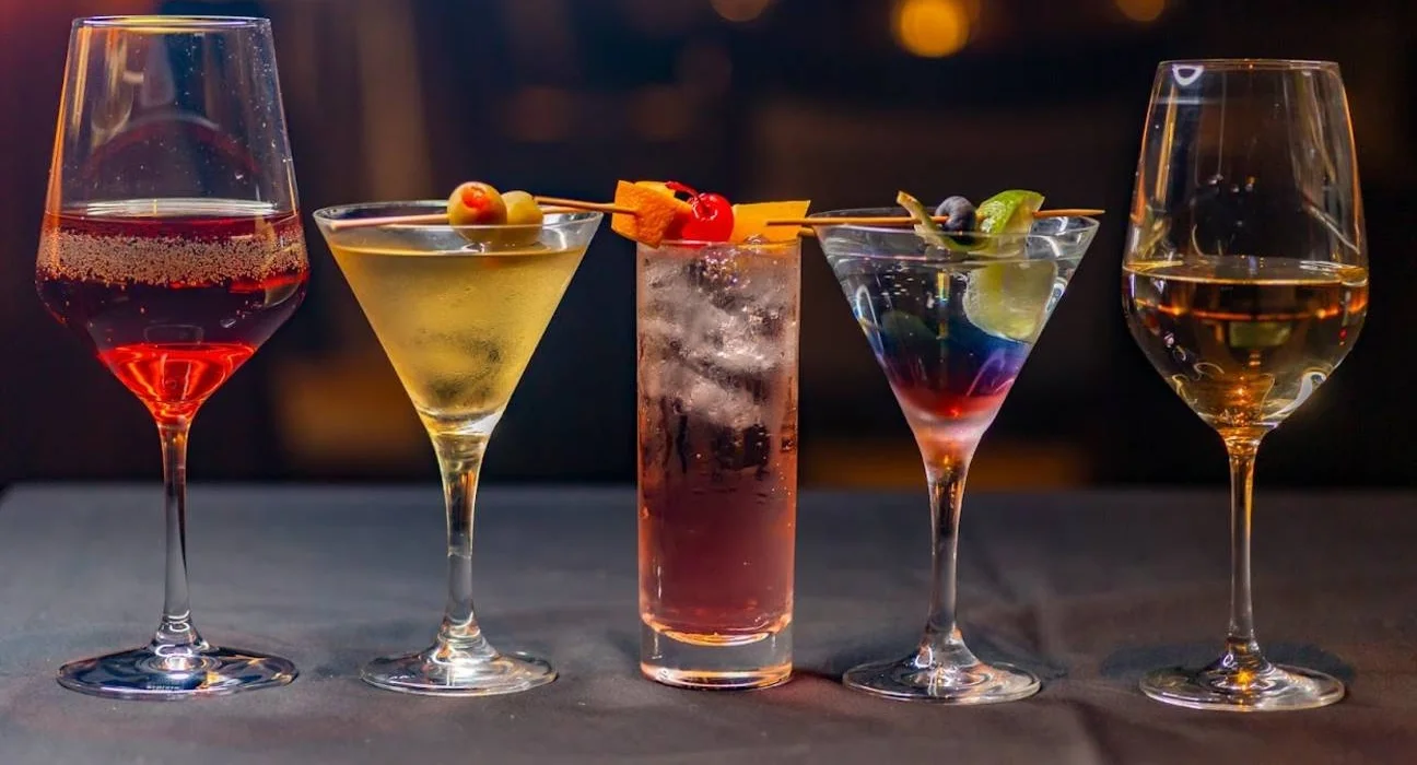 A selection of colorful and artfully presented cocktails at Irina's Steak and Seafood, showcasing the variety of drinks offered.