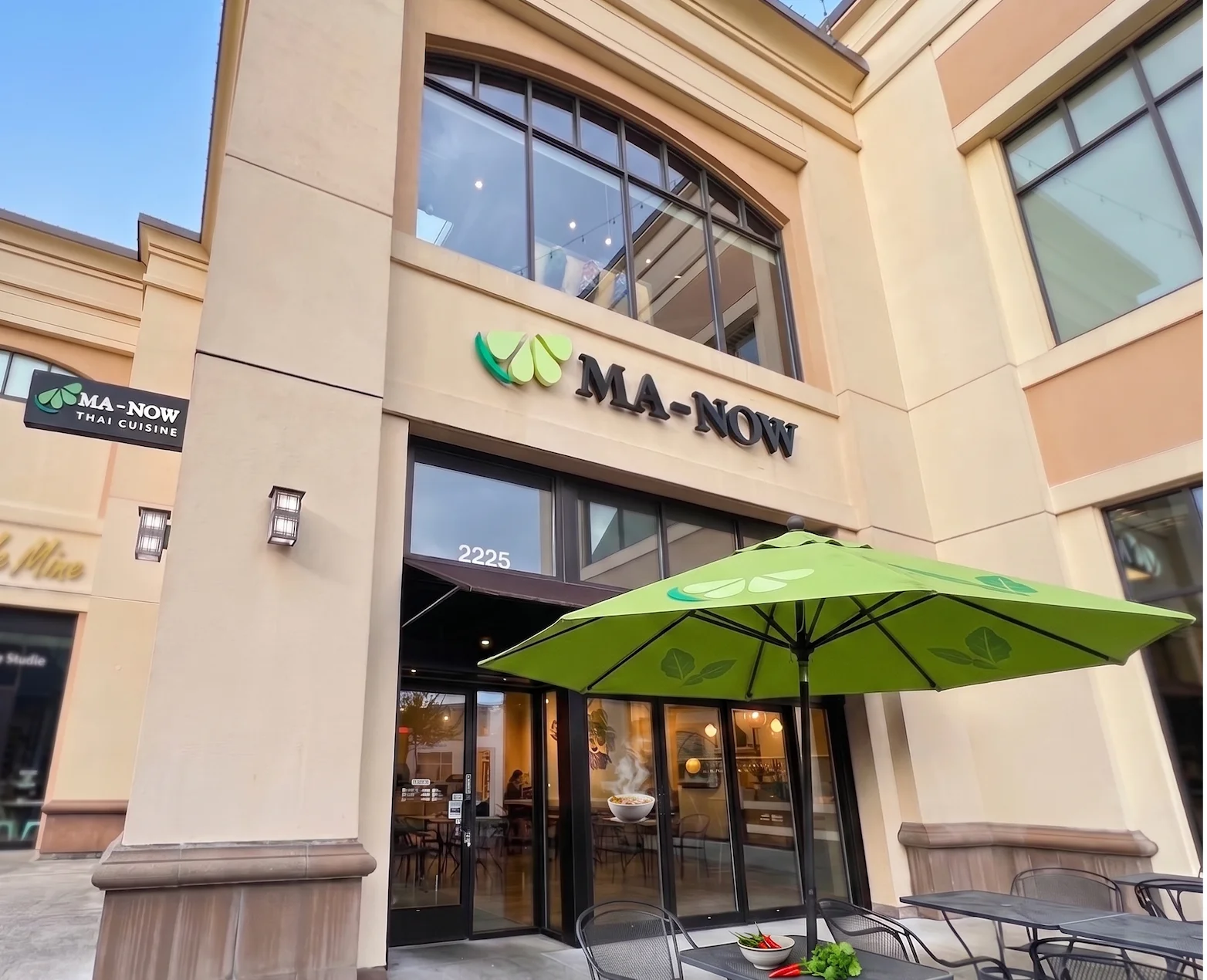 Exterior view of MA-NOW Thai Cuisine restaurant with outdoor seating