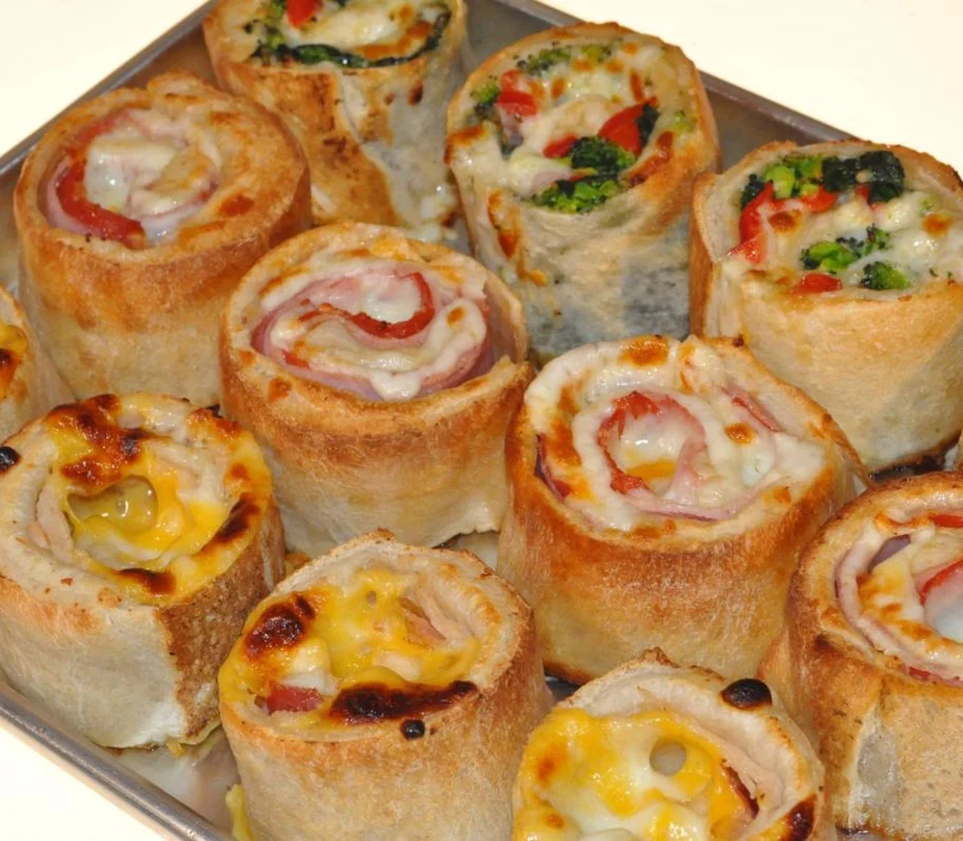 A tray of Patio's pinwheels with ham, cheese, broccoli and peppers