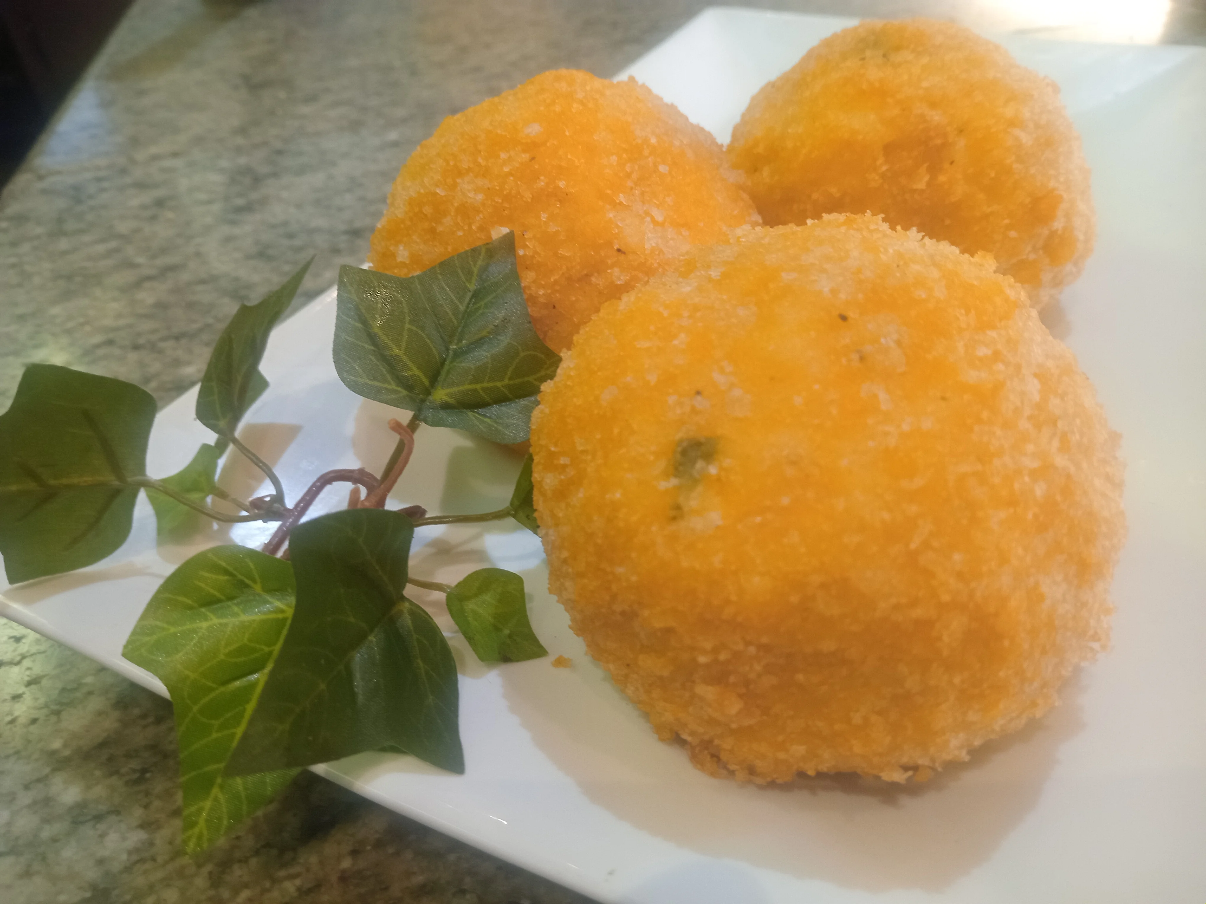 Crispy Brazilian coxinha on a white plate