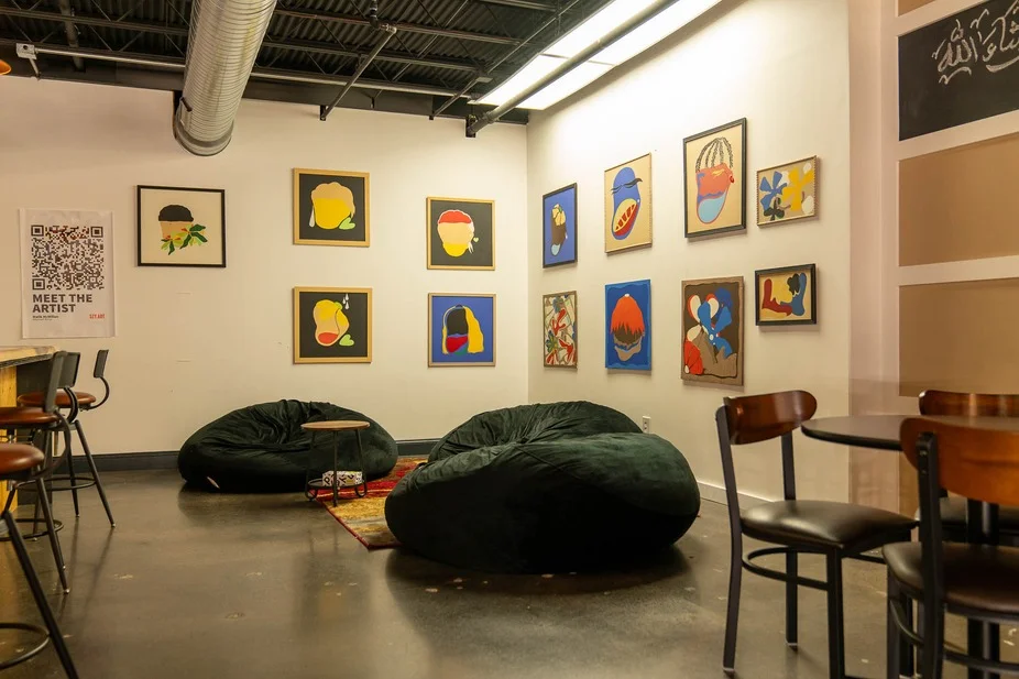 Art-filled cozy restaurant interior with bean bags and modern decor