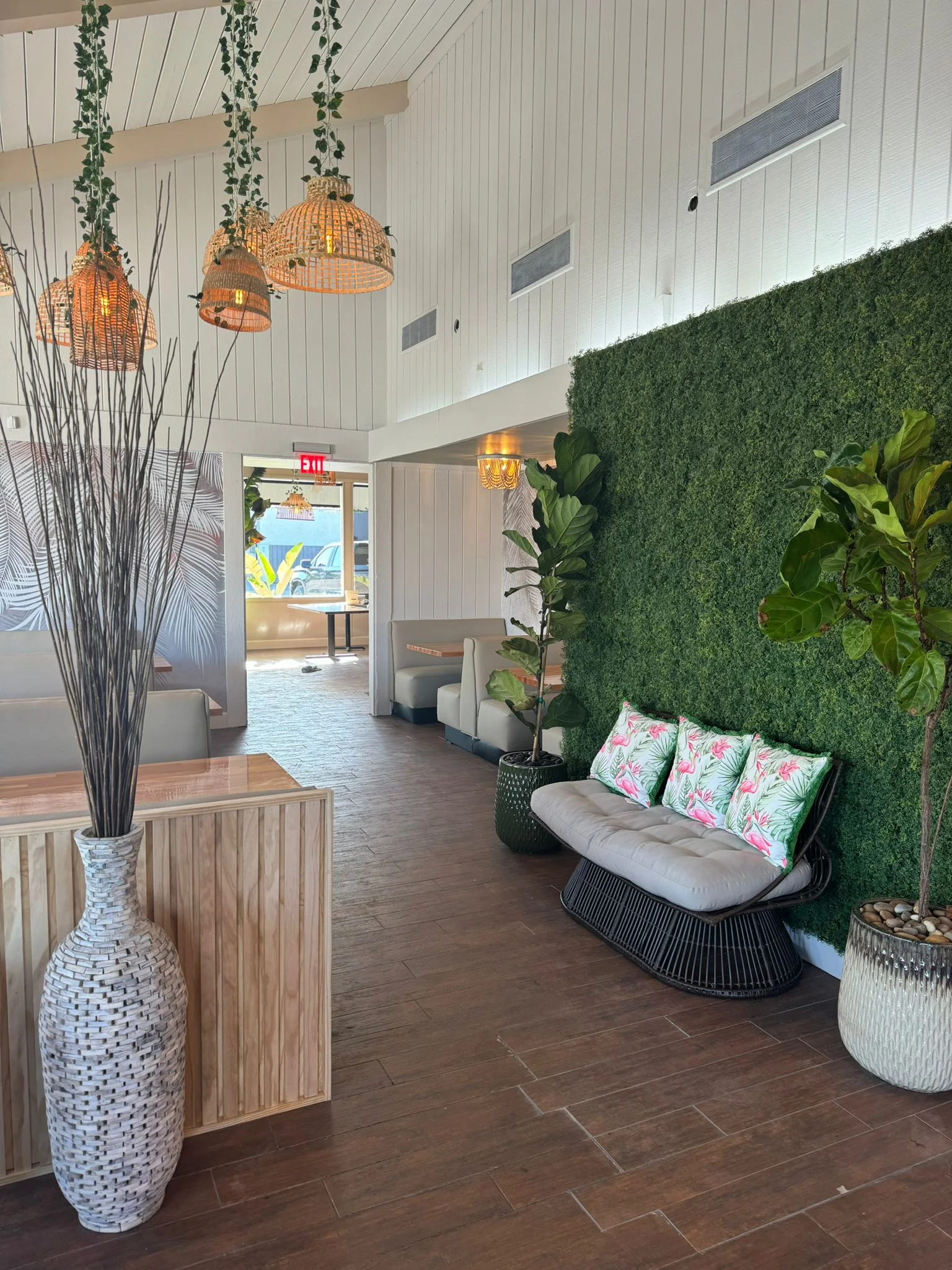 Stylish restaurant interior with greenery and modern decor