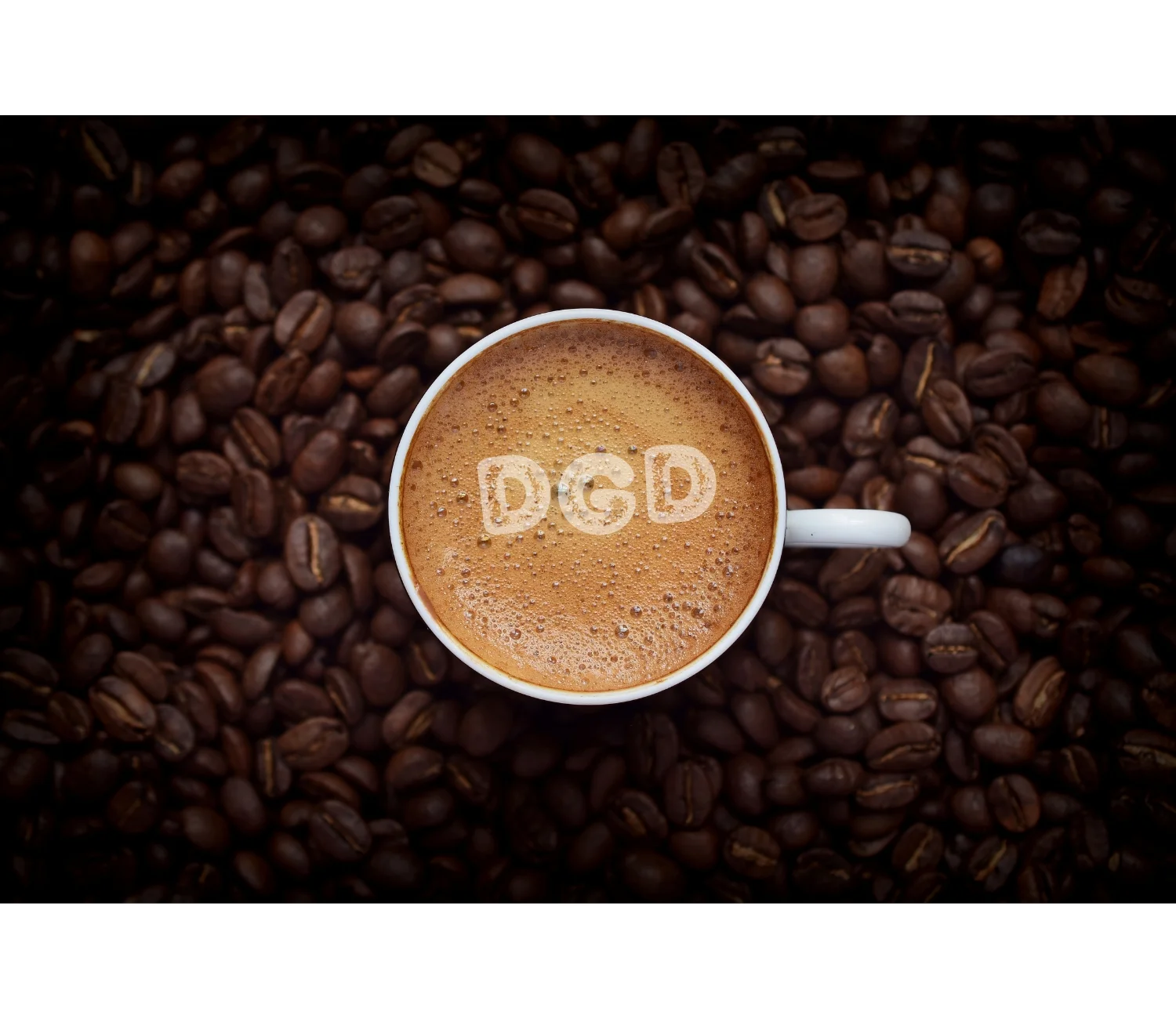 Cup of rich espresso surrounded by coffee beans