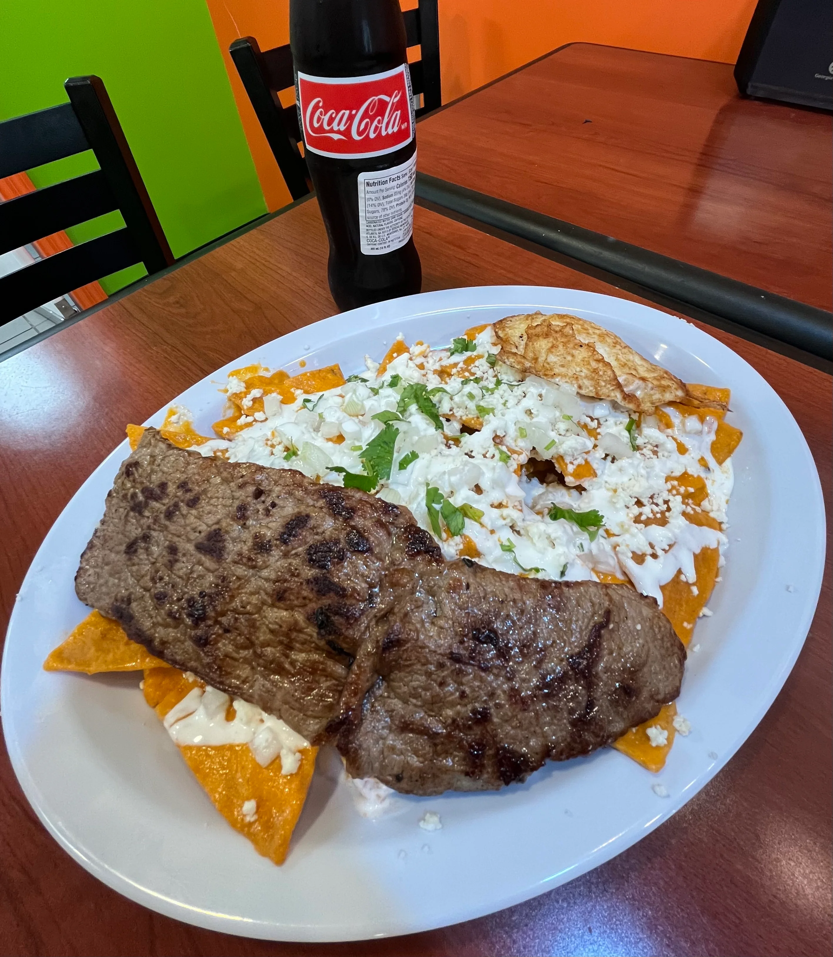 Delicious gourmet burger with fresh toppings on a wooden table.