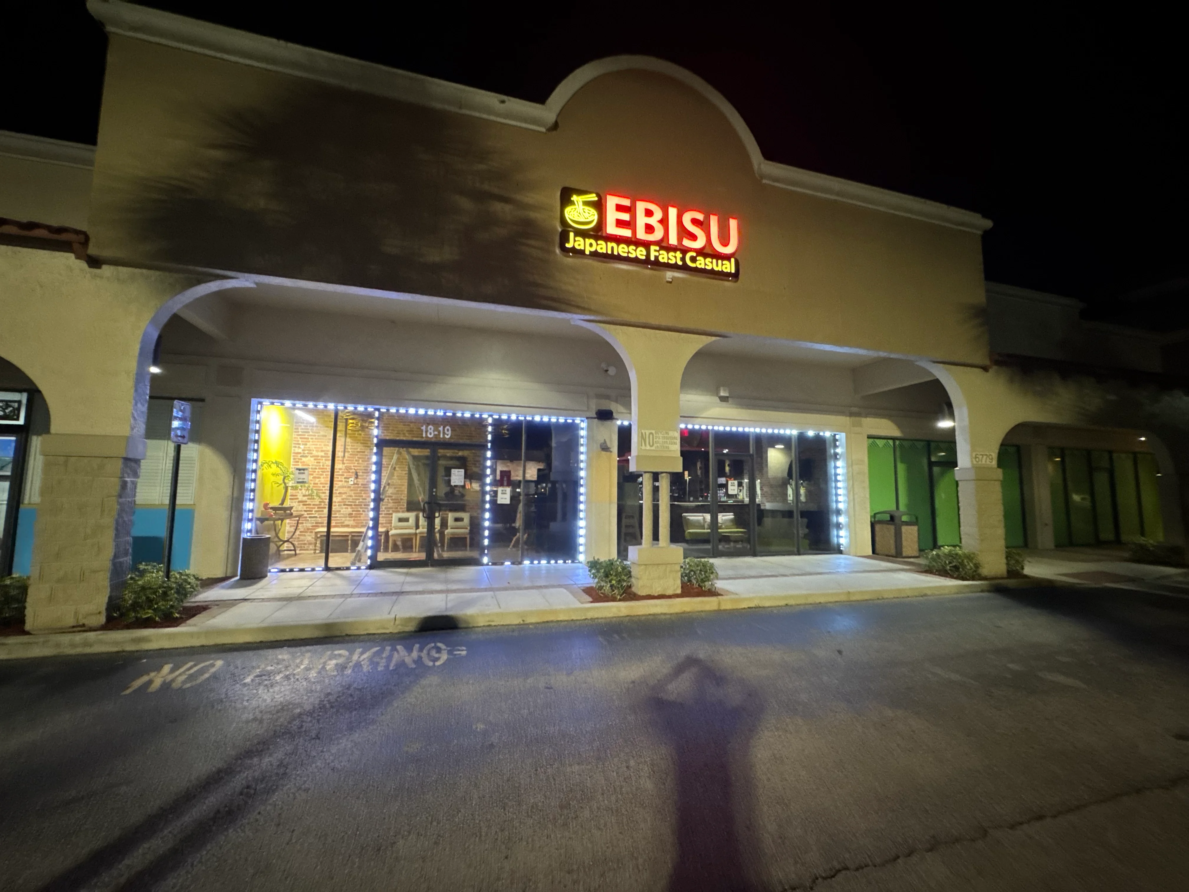 Exterior of Ebisu Japanese Fast Casual restaurant at night