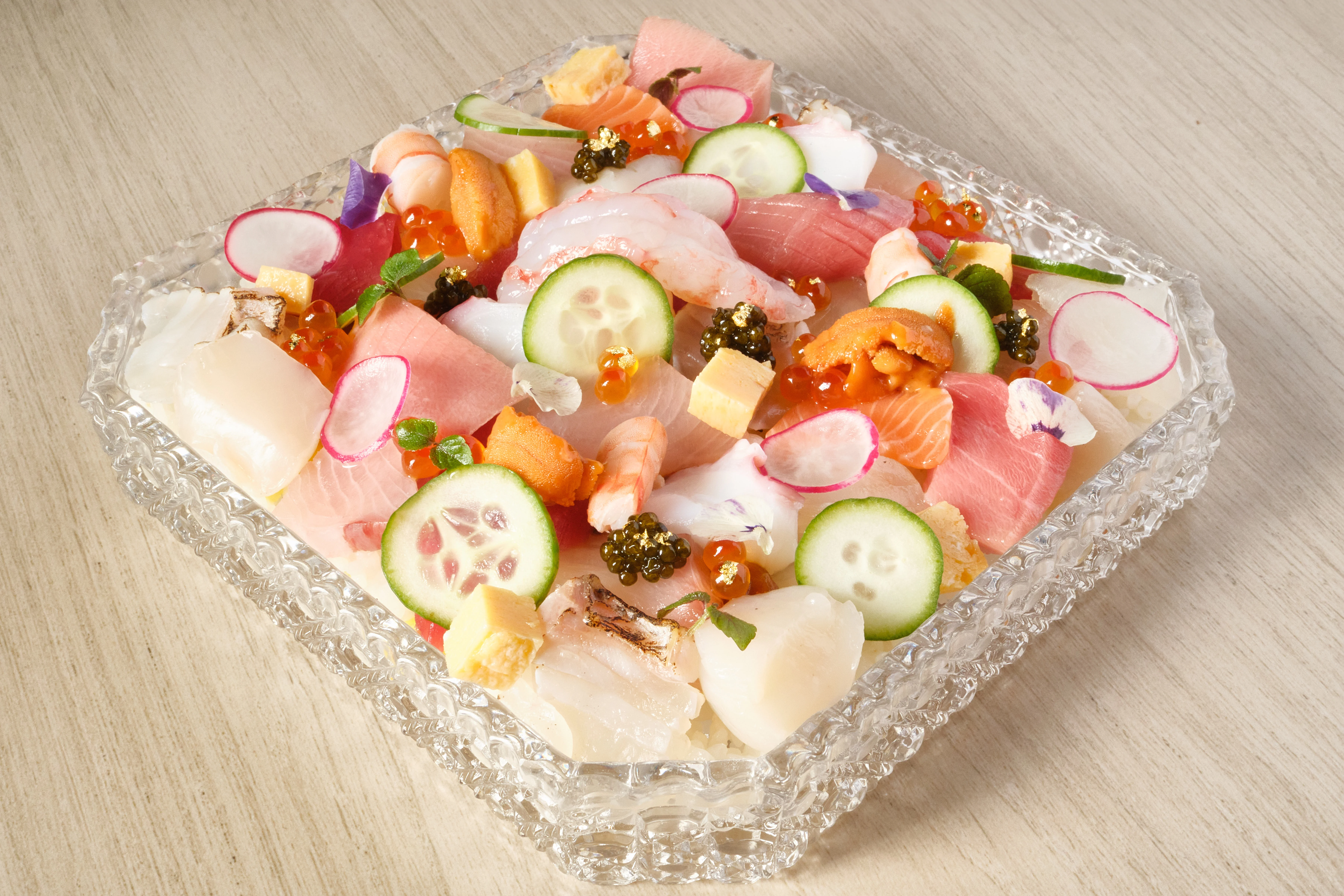 Japanese chirashi sushi beautifully arranged with fresh seafood and garnishes