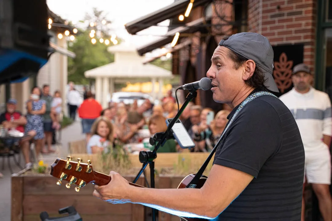 Live music performance at a vibrant outdoor restaurant