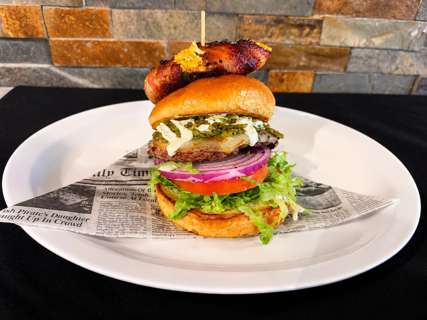 Gourmet burger with bacon and fresh toppings