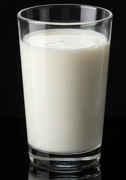 Glass of fresh milk on a dark background