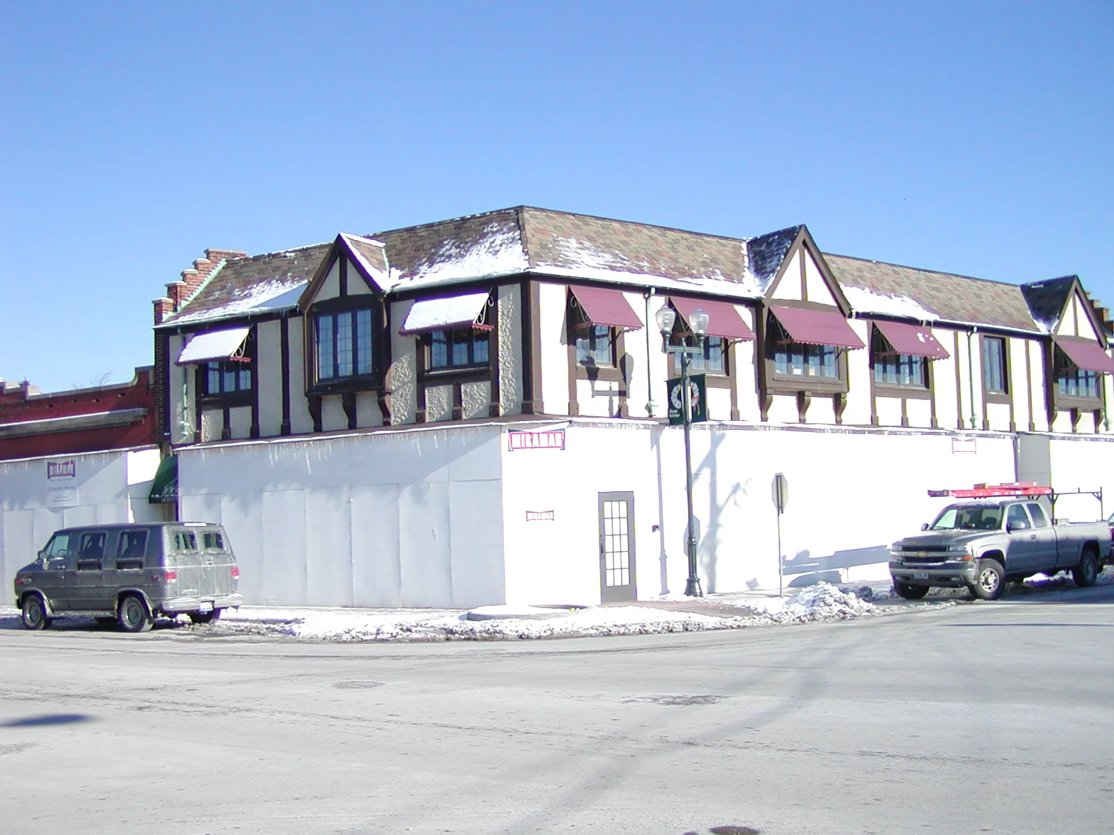 Charming restaurant exterior with Tudor-style architecture and snow-covered surroundings