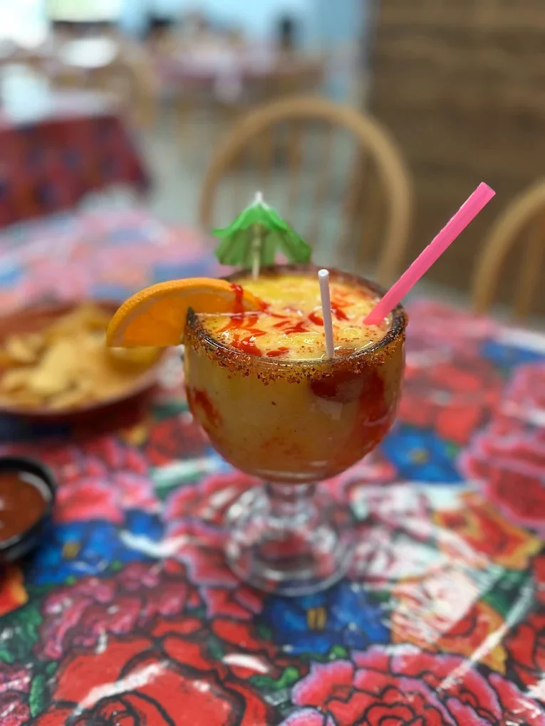 Colorful margarita cocktail with fruit garnish