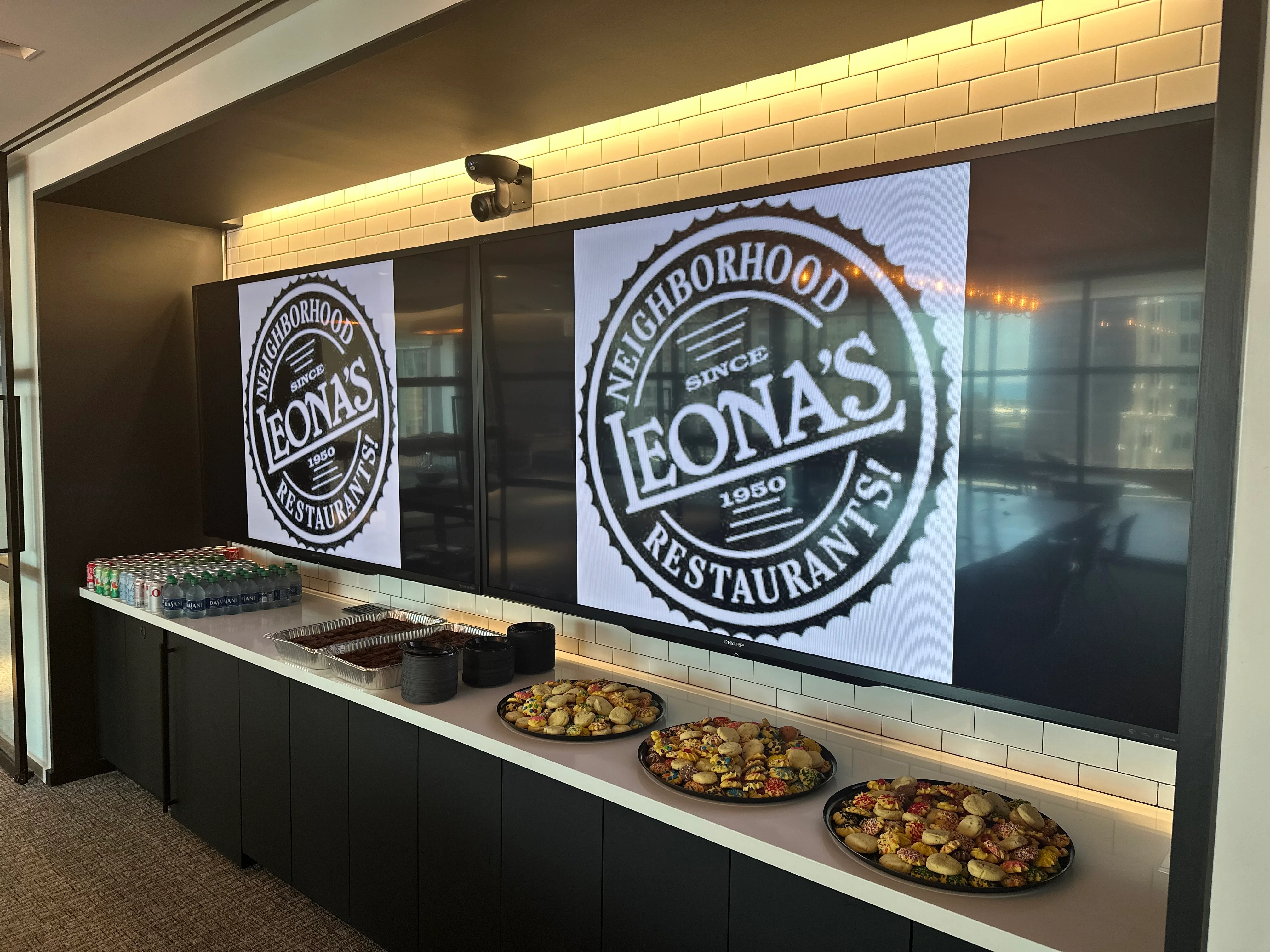 Restaurant display featuring Leona's logo and assorted appetizers