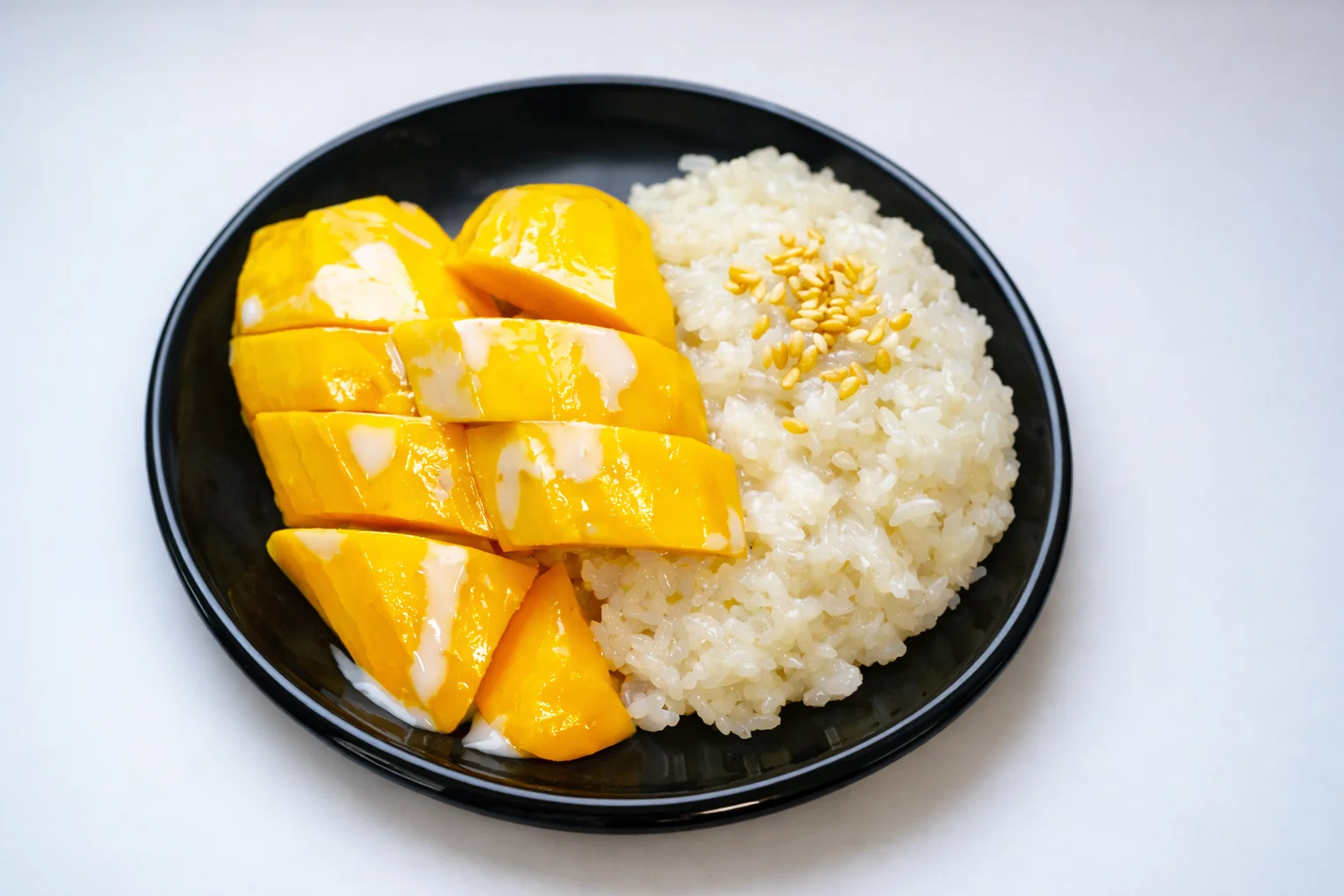 Thai mango sticky rice dessert with coconut cream