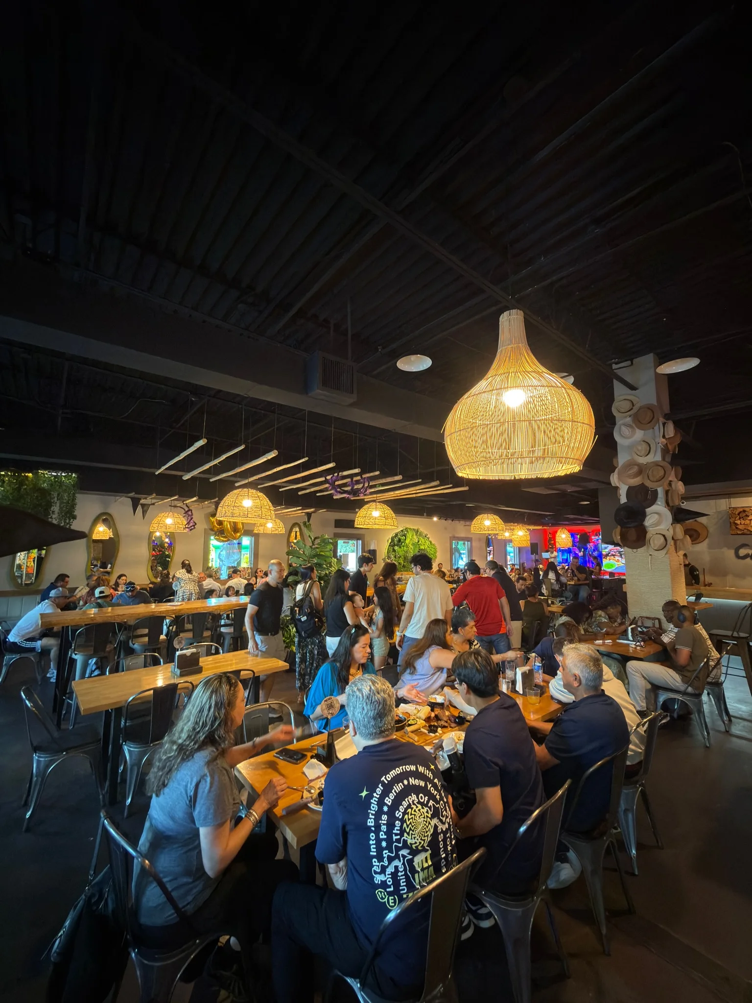 Lively restaurant interior with warm lighting and bustling diners