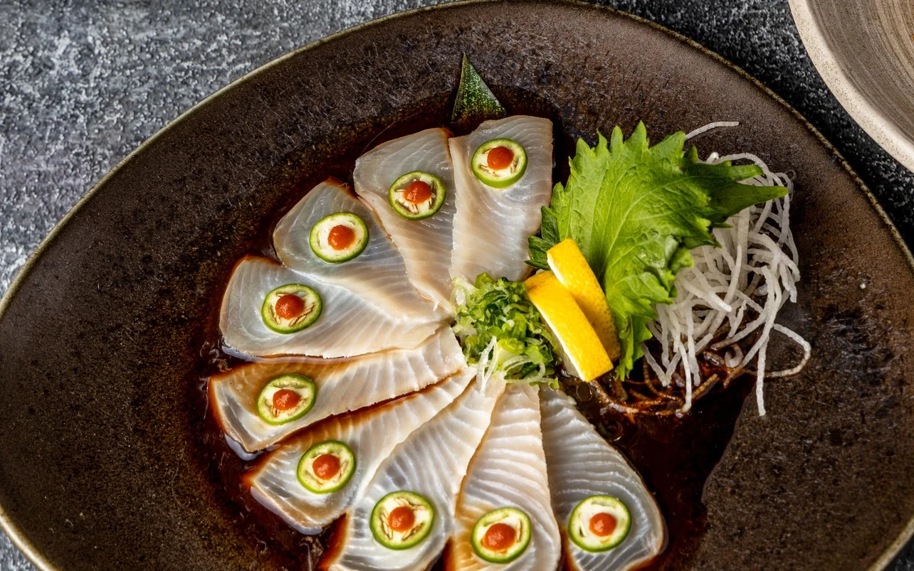 Assorted Japanese sashimi platter with fresh fish and garnishes