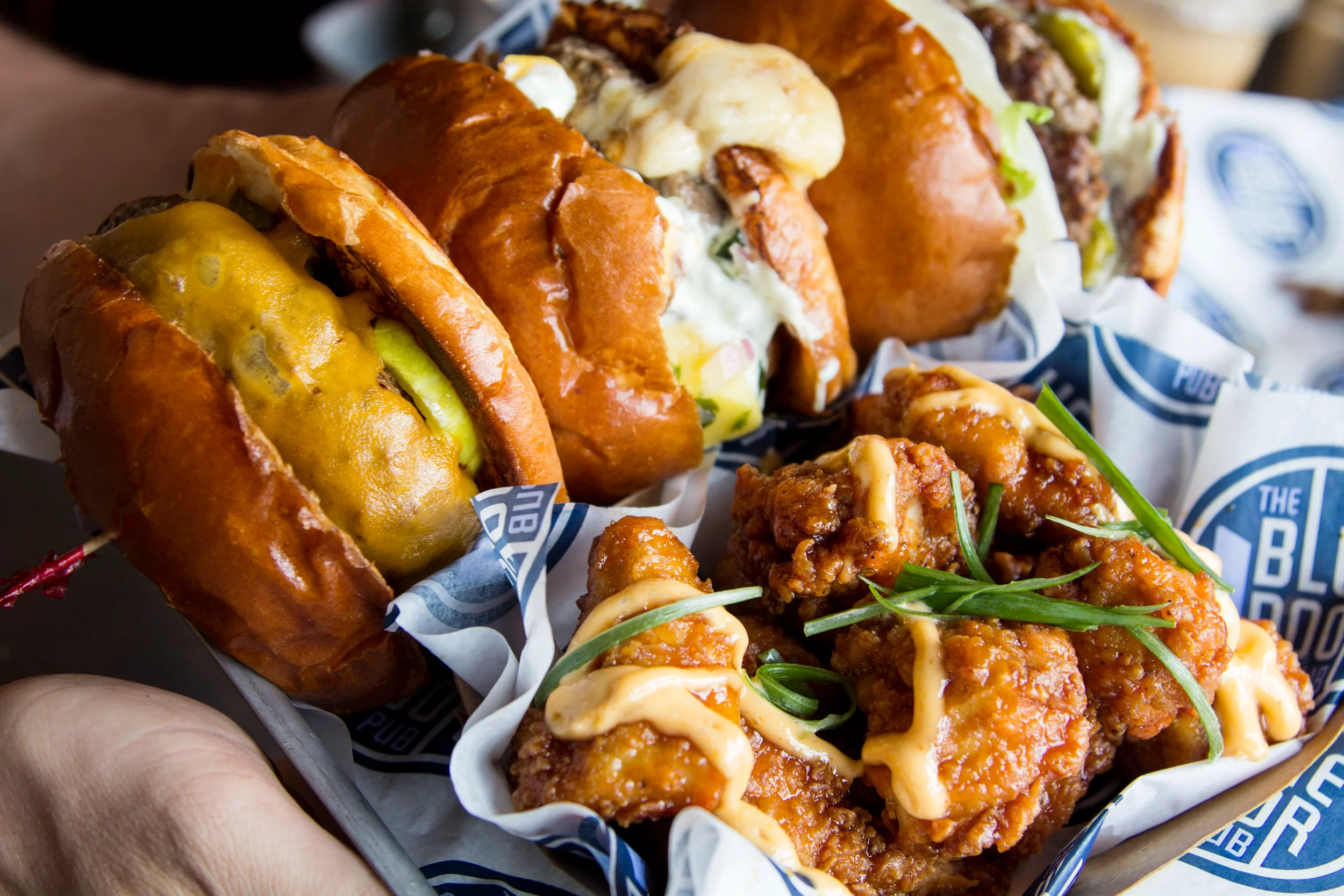 Gourmet sliders and crispy chicken wings in a casual dining setting