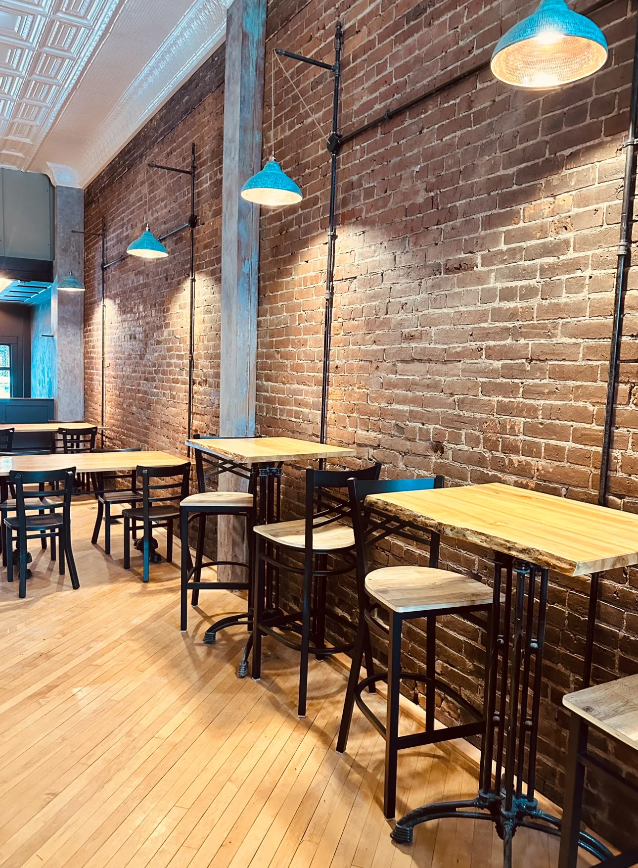 Cozy restaurant interior with exposed brick and modern seating