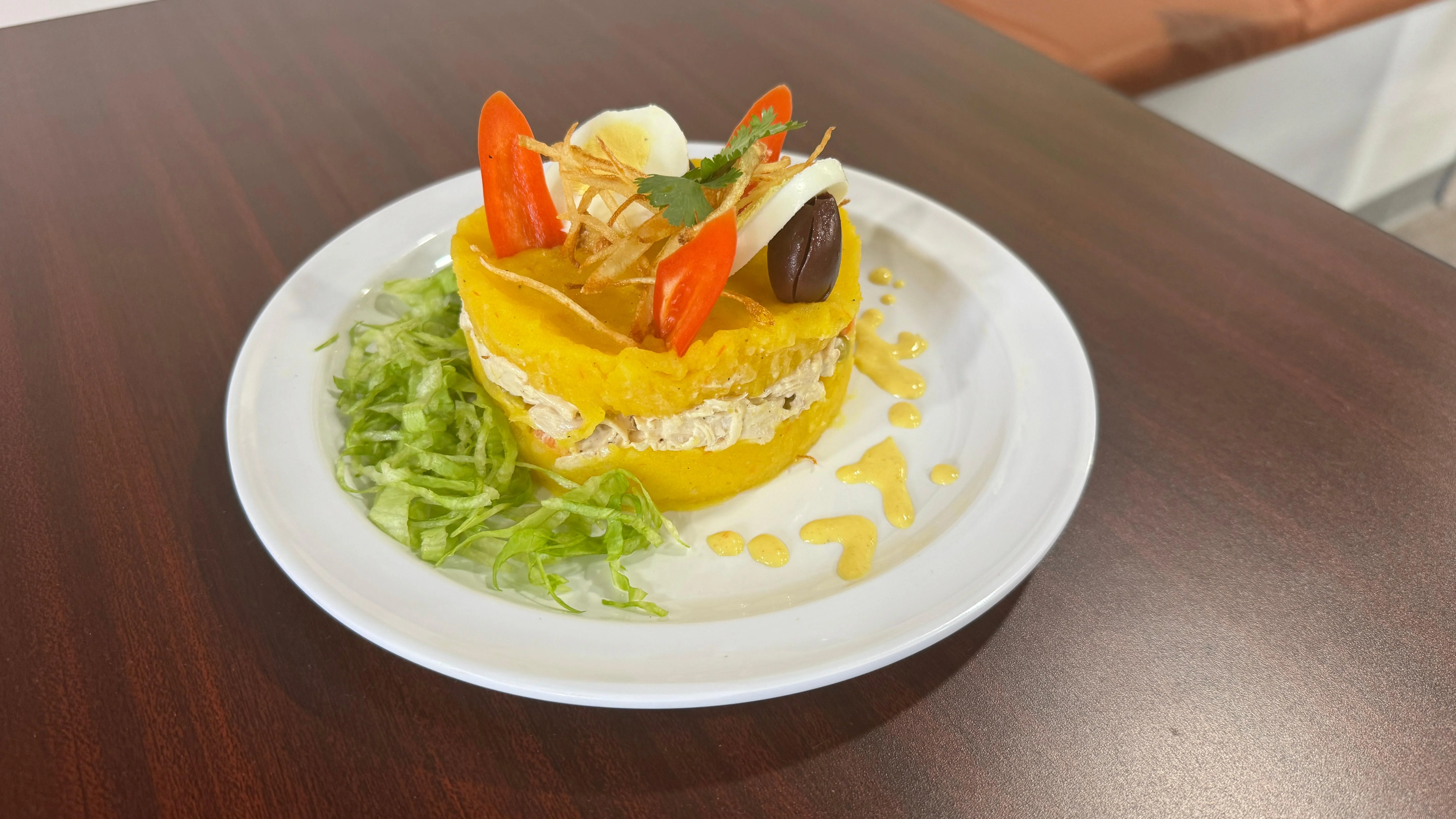 Peruvian causa limeña with chicken and avocado