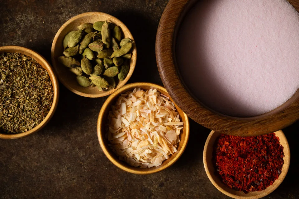 Assorted spices in wooden bowls for Indian cuisine