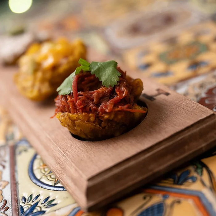 Delicious gourmet burger with fresh toppings on a wooden table
