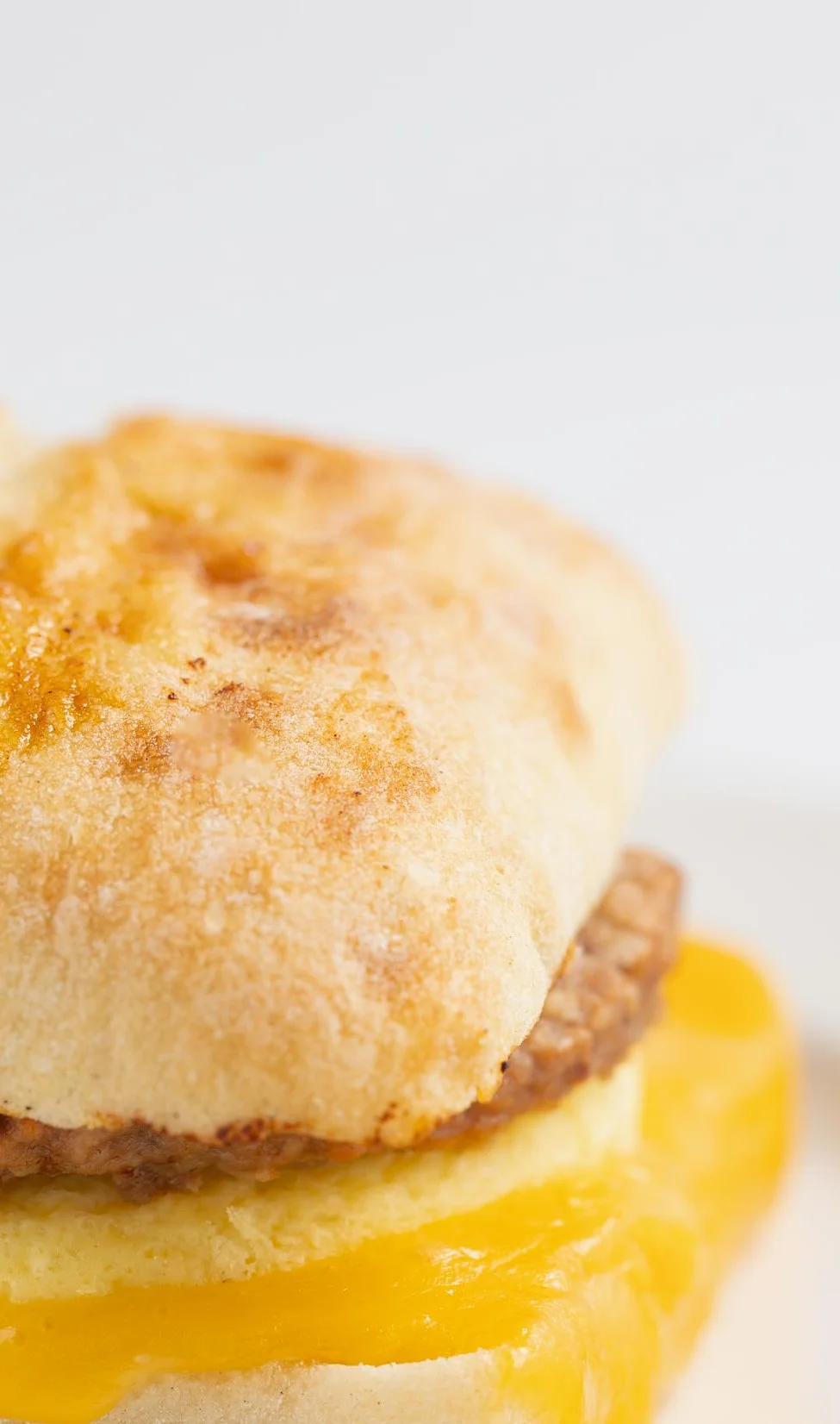 Breakfast sandwich with sausage and cheddar cheese
