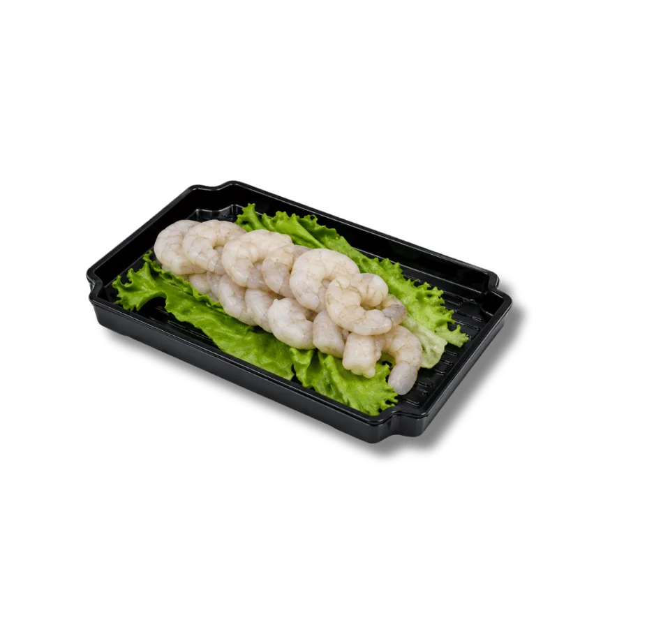 Raw shrimp on lettuce in a black plastic container