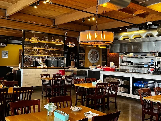 Cozy restaurant interior with wooden decor and warm lighting