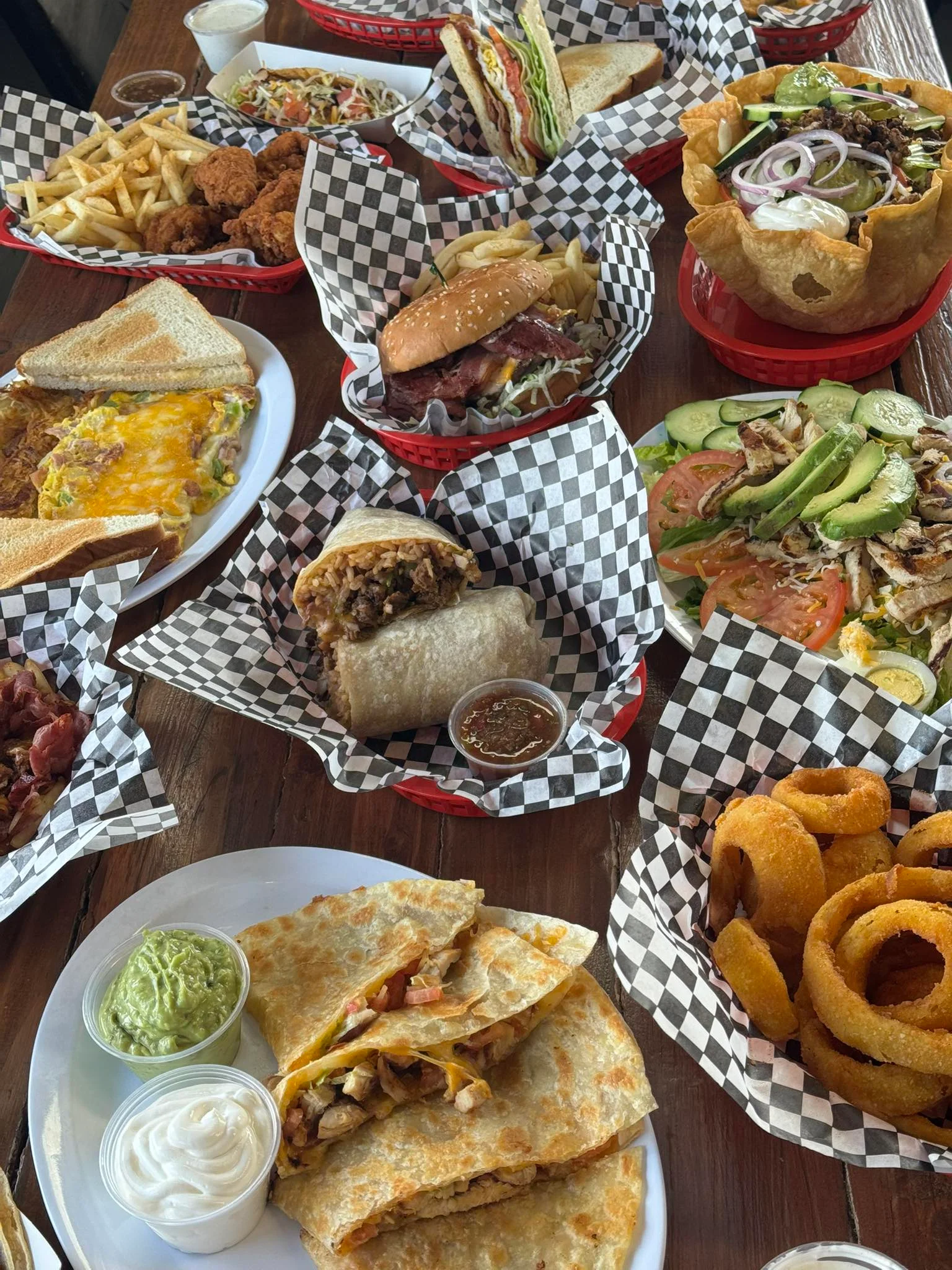 Delicious gourmet burger with fresh toppings on a wooden table