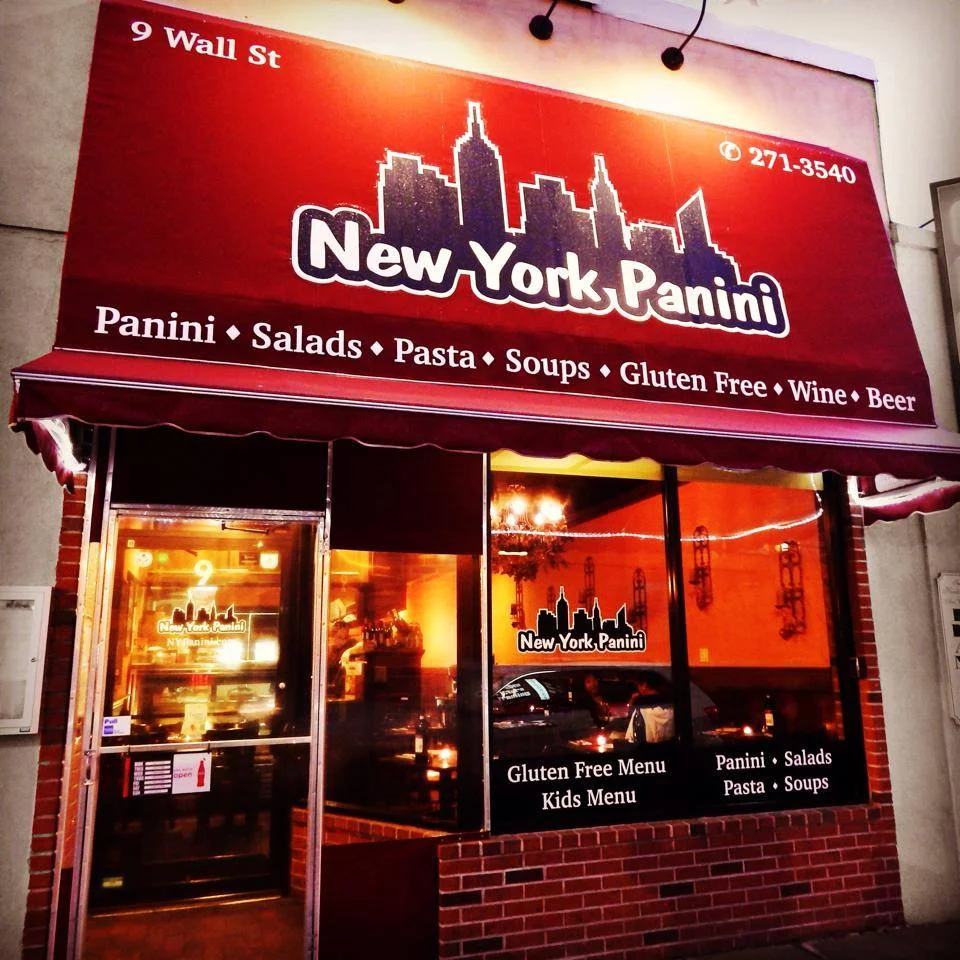 Exterior view of New York Panini restaurant with inviting signage