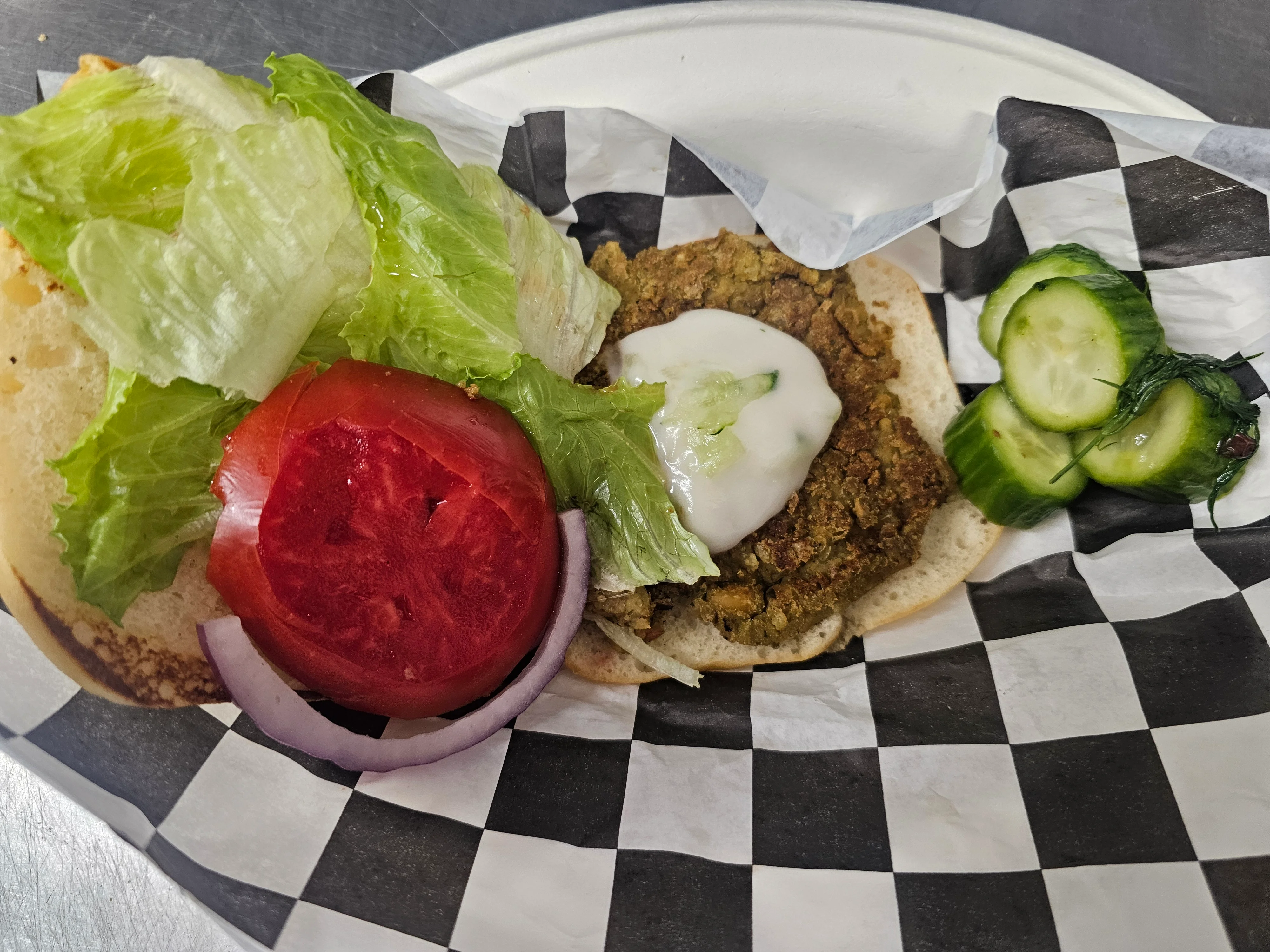 Falafel sandwich with fresh vegetables and sauce
